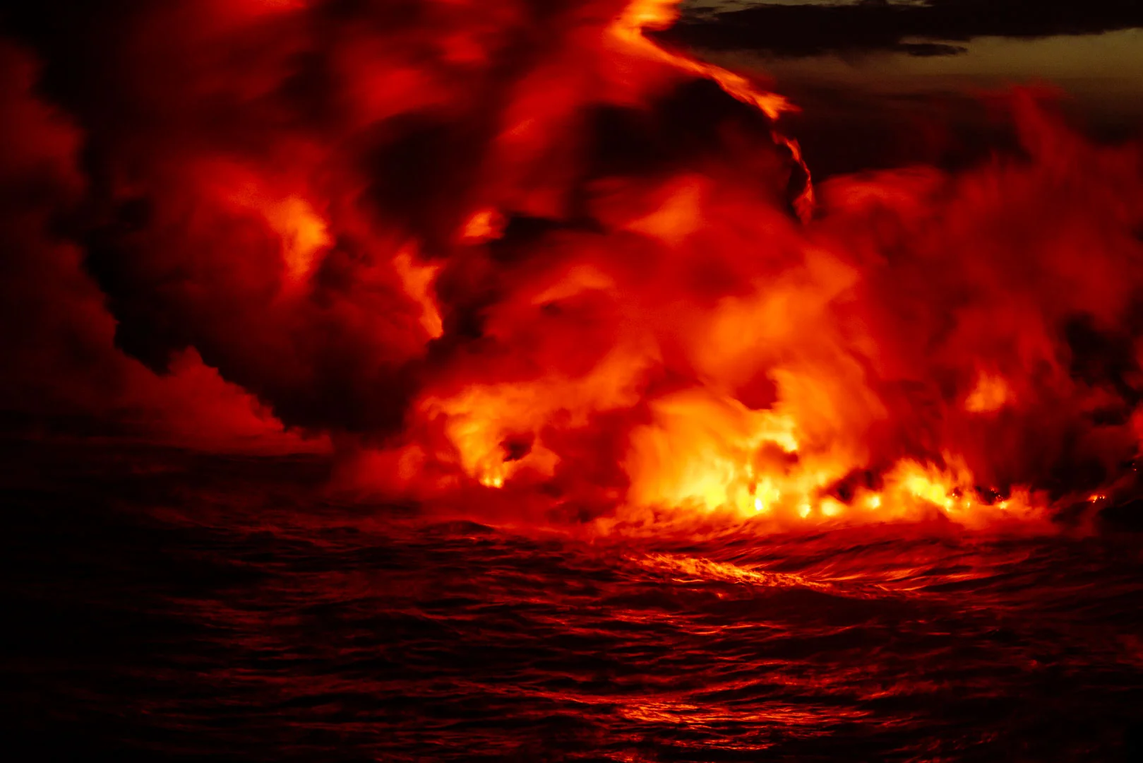 LAVA ENTERS THE OCEAN AT VOLCANOES NATIONAL PARK IN HAWAI'I