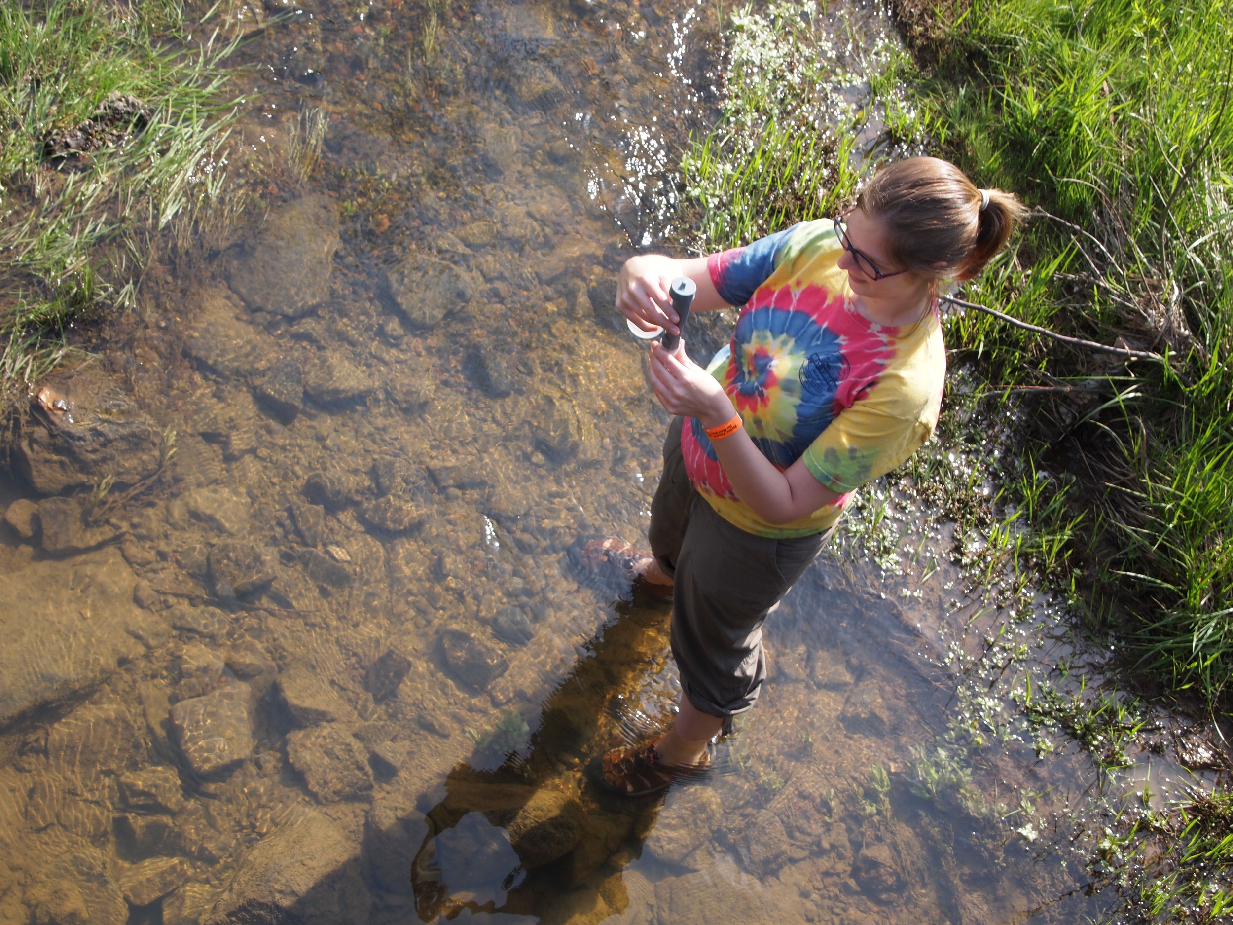  WV Rivers staff member Kathleen Tyner takes a conductivity reading as part of WV Rivers volunteer monitoring program. 