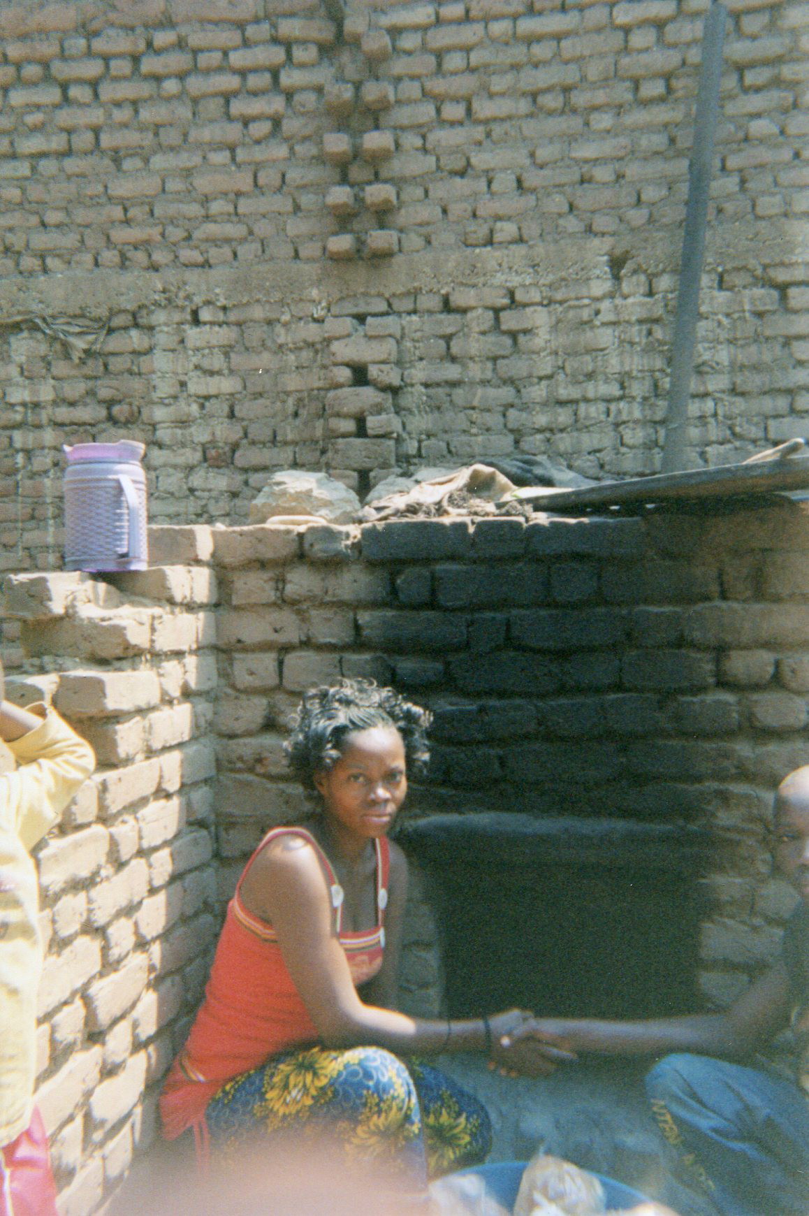  This photo shows how a boy ex-combatant helped me a lot — he helped me learn how to make bread after I had been trained in making doughnuts. On photo number six, there is a local oven for baking bread.&nbsp; 