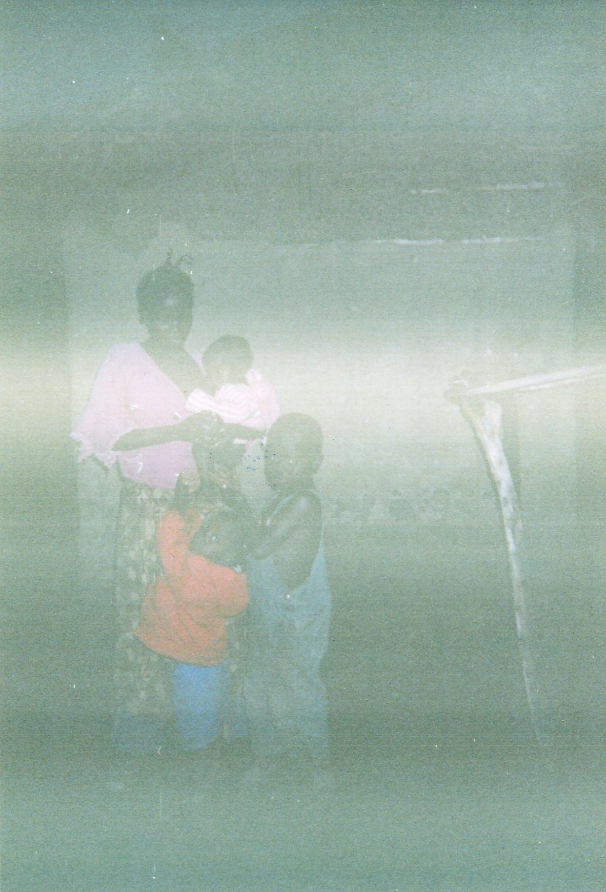  This photo of me and my children shows how we suffered without food and shelter. We continue to suffer until today.   