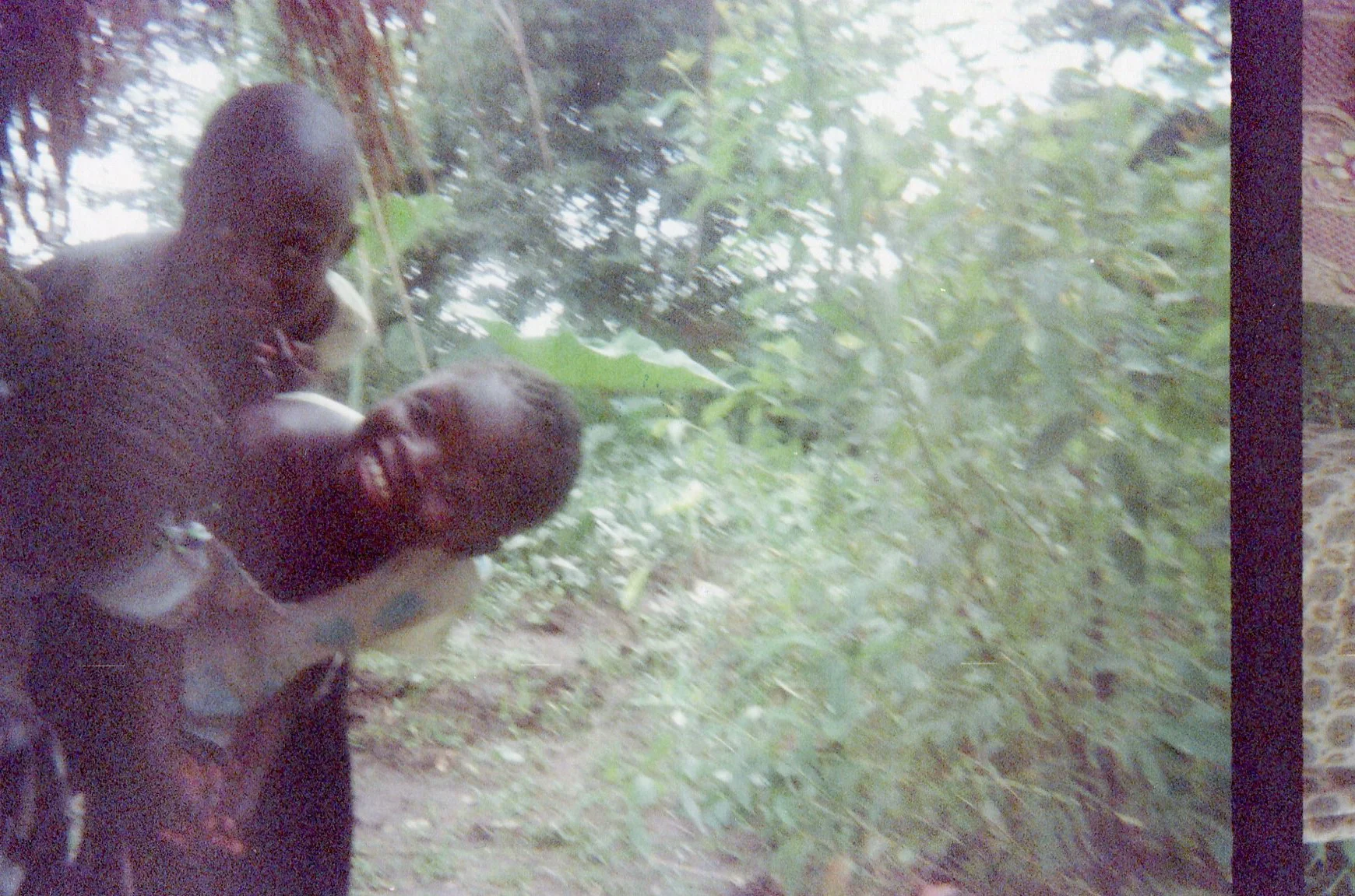 These children are hidden in the bush, fearing the combat. 