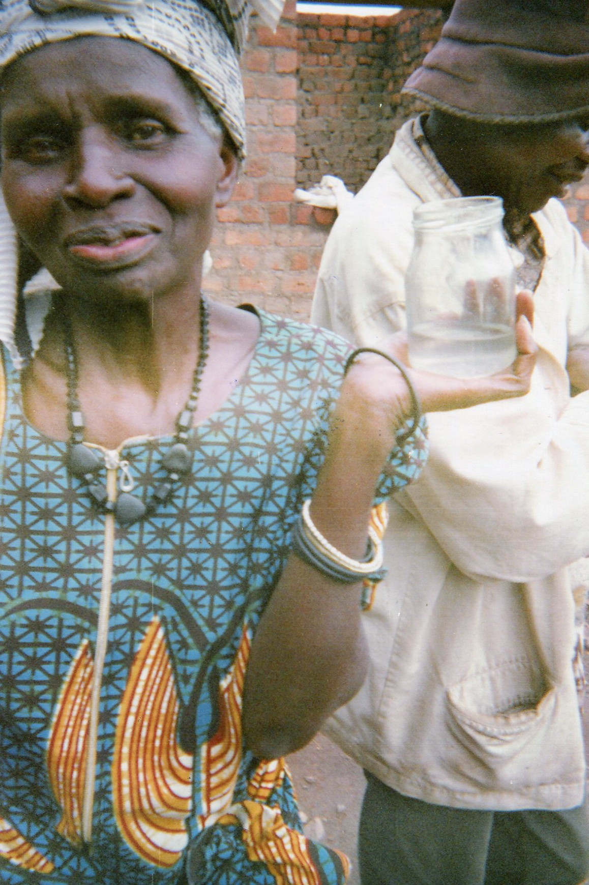  The members of the community manifest their discontent of supporting child soldiers (criminals, rapists, represented by this poison in this glass).&nbsp; 