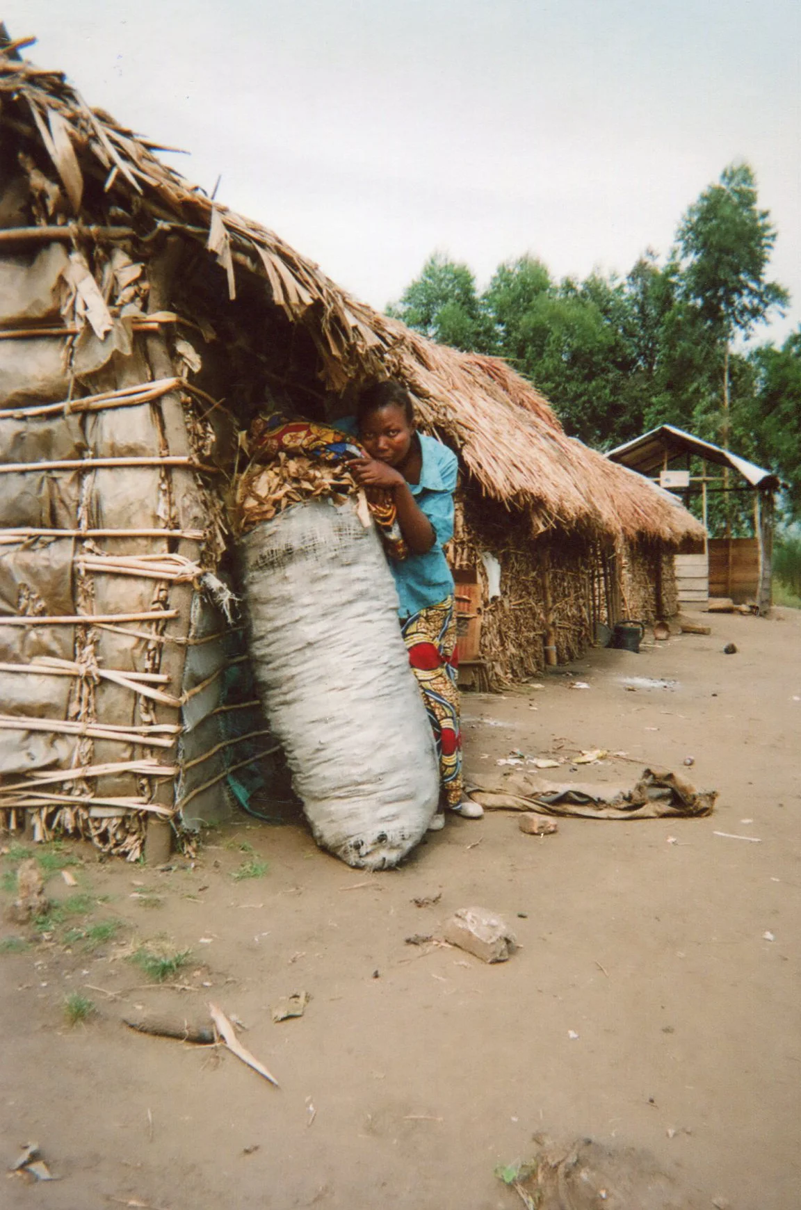 They are forcing me to carry loads of charcoal and I am carrying them to the destination. 