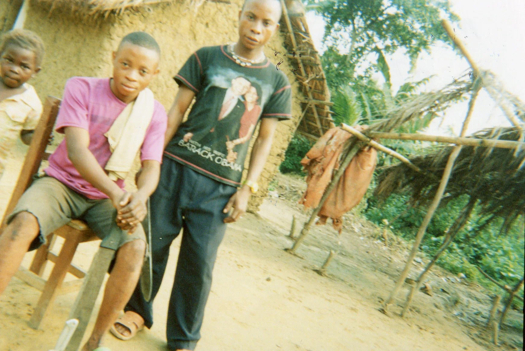 These young boys are my brothers who have machetes for farm activities. 