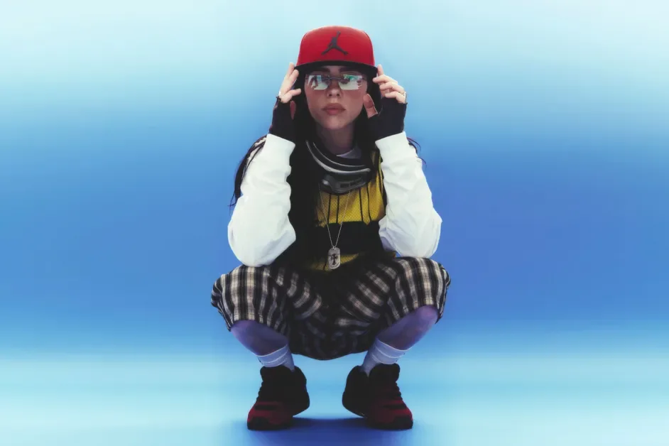 Billie Eilish photographed in Petros Studio, wearing a stylish outfit, posing confidently, highlighting her unique fashion and artistic persona