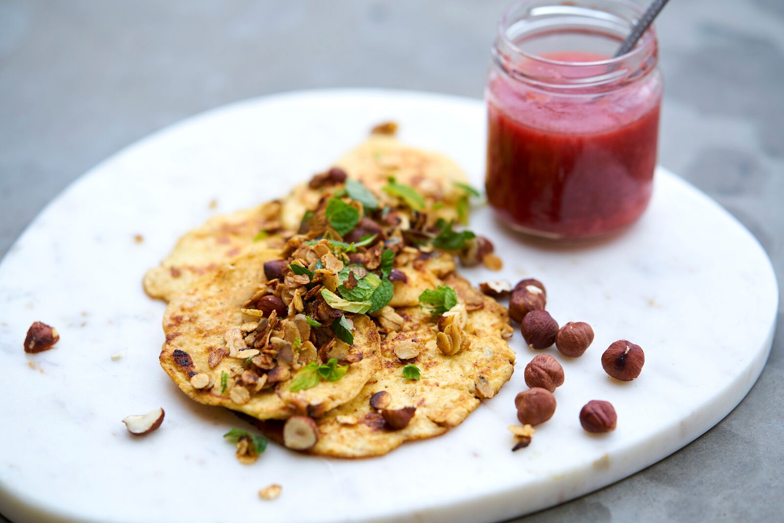 Sweet treat leftover pancakes of oat-porridge with kefir served with rhubarb jam and honey roasted oats and hazelnuts. Photo: Alexander Benjaminsen.