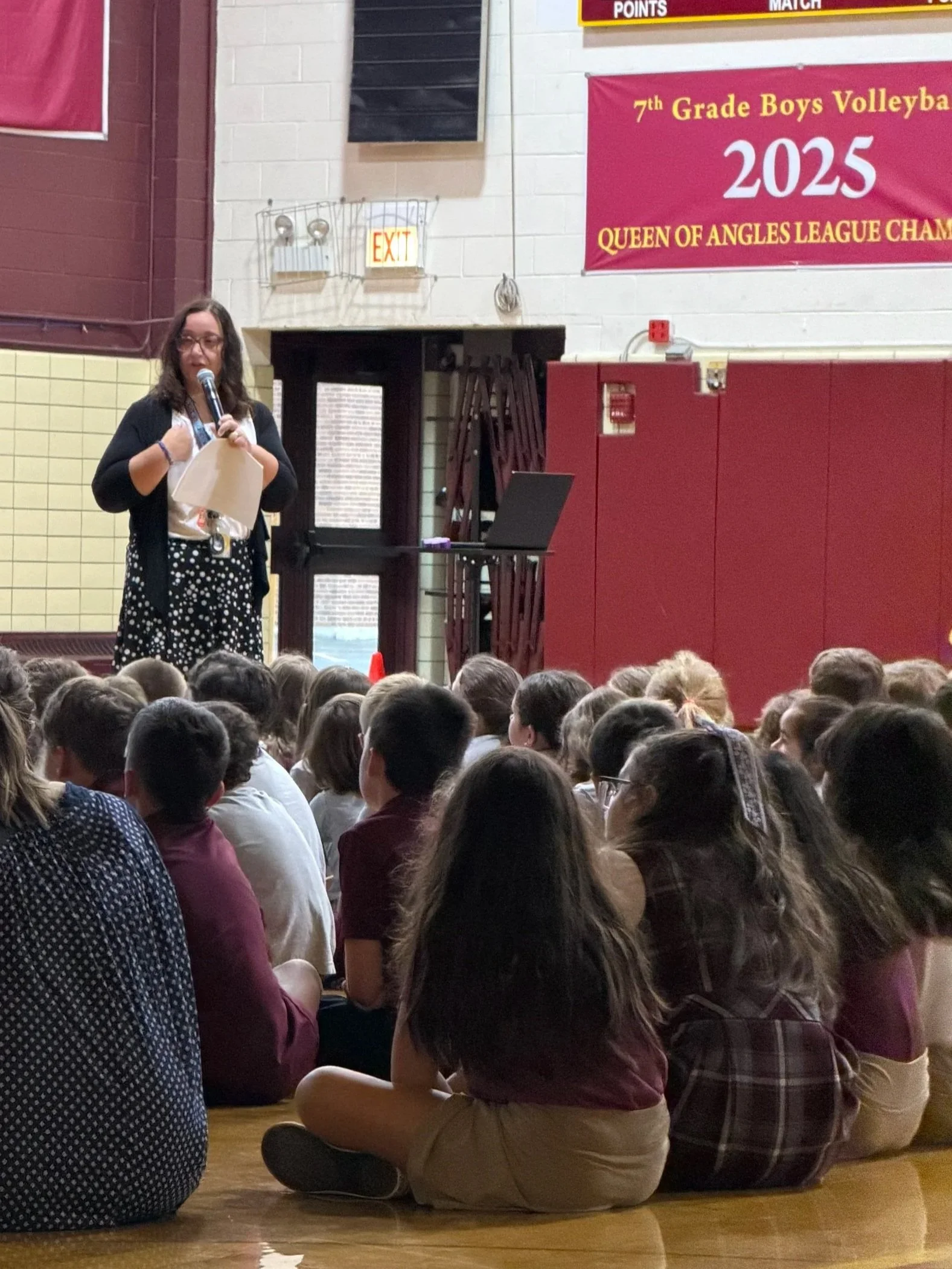 Ms. Gemo leads the students in the first assembly of the year. 