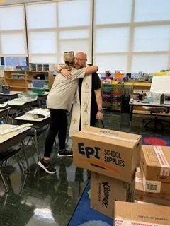 Ms. Brizgys's room gets a blessing from Father Ryan. 