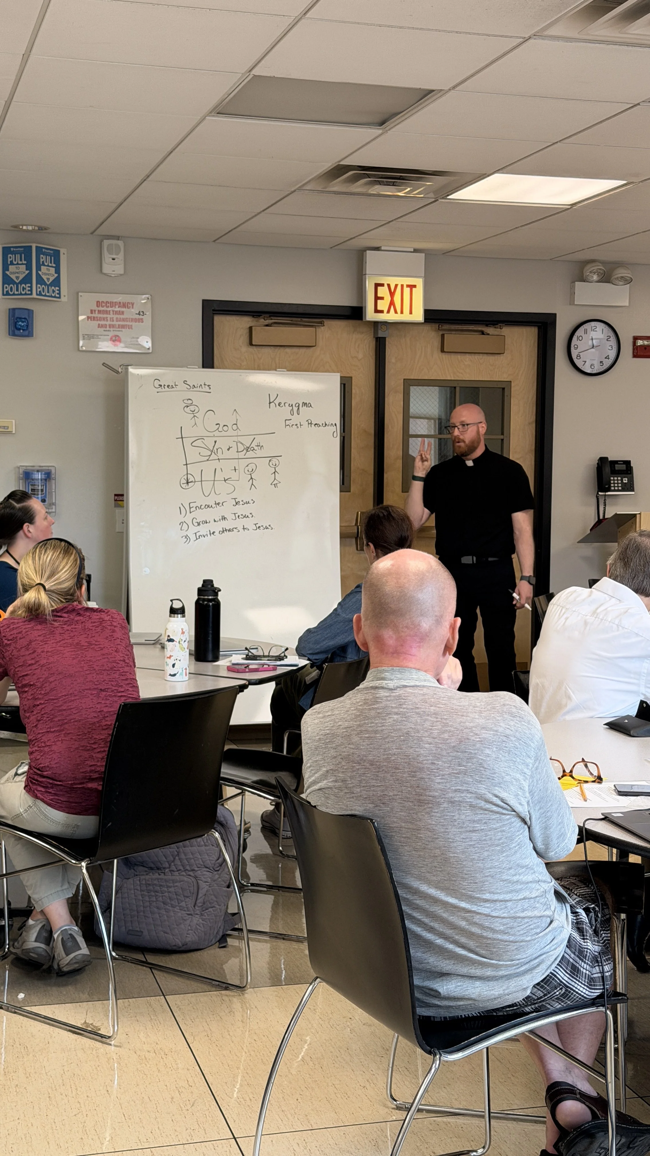 Father Ryan teaching our staff about the Kerygma. 