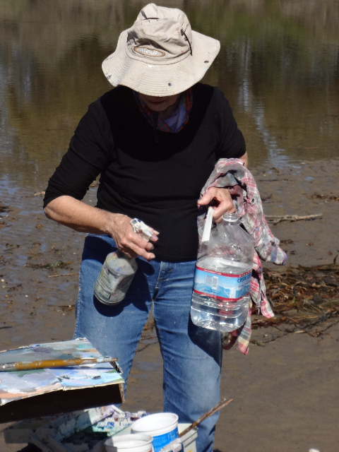 Painting in the direct sun with acrylics demands a jug of water and spray bottle.