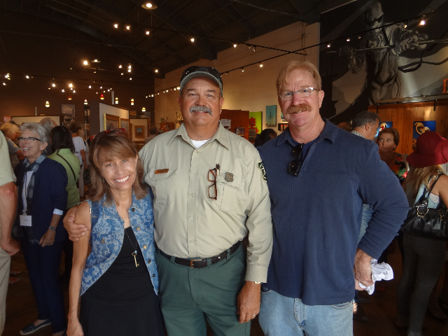 Guests Ellen and Jim Clark bookending "Poncho" Smith