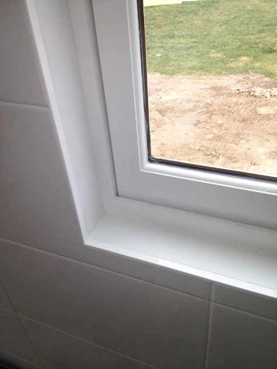 Clean finishing edge trim for tile wall at window