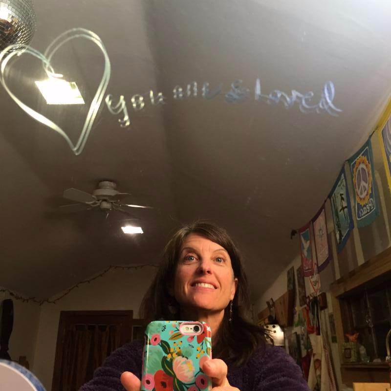 In my studio I write notes to stay inspired. This one says "you are loved".
