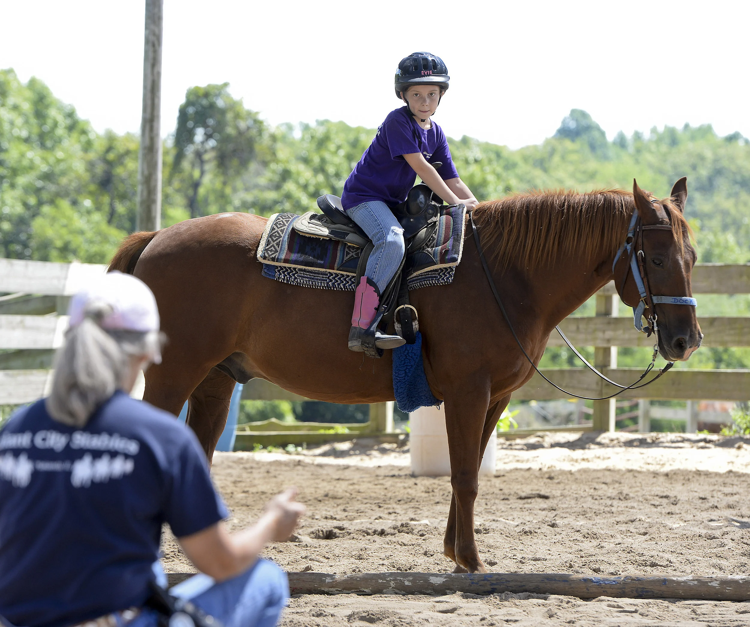 Evelyn Eddings, 9, of Anna, Ill., receives a lesson from her instructor Ramona Twellman on Sept. 7 at Giant City Stables in Makanda, Ill.