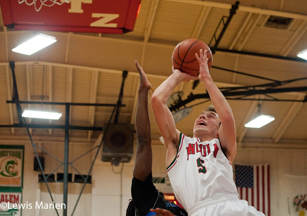 Lincoln's Aron Hopp (5) drives to the basket during the Railers' regional championship game with the Decatur MacArthur Generals at Mount Zion High School in Mount Zion, Ill. MacArthur won 57-38.