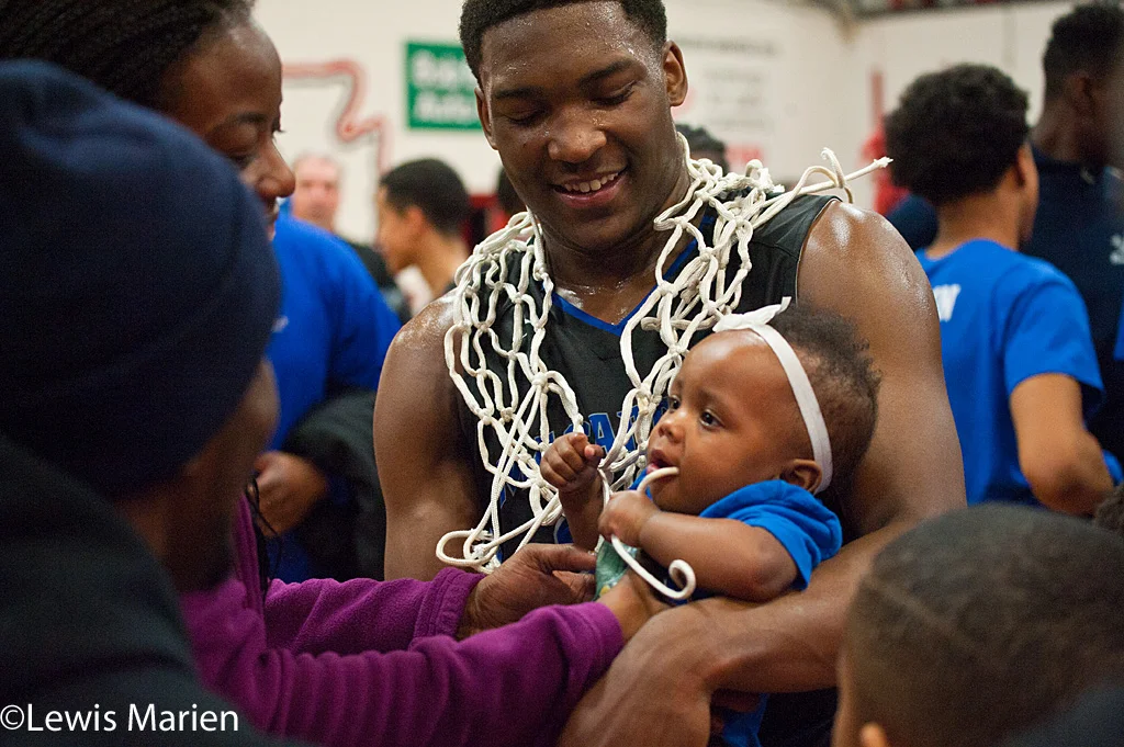 MacArthur's Kamari Jones (22) celebrates after the Generals' regional championship game with the Lincoln Railers at Mount Zion High School in Mount Zion, Ill. MacArthur won 57-38.