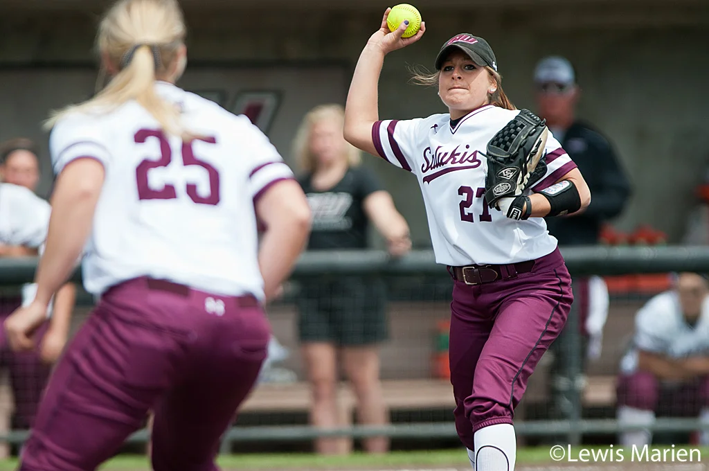 Southern Illinois' Katie Bertelsen (27) fields a ground ball to Shaye Harre (25) for an out during Game 1 of a doubleheader against Drake University at Charlotte West Stadium. Drake beat SIU 3-2.