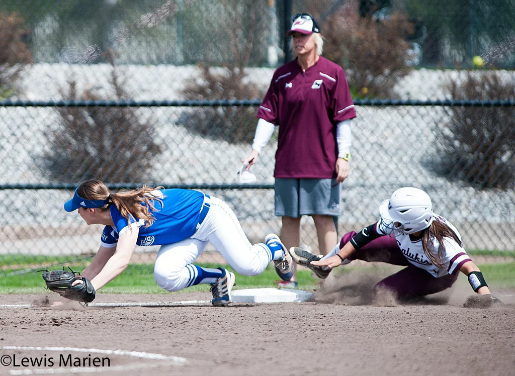 Southern Illinois' Kelsey Gonzalez slides into third during Game 1 of a doubleheader against Drake University at Charlotte West Stadium. Drake beat SIU 3-2.