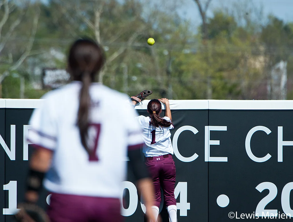 Southern Illinois' Merri Anne Patterson (1) and Kelsey Gonzalez (7) can only watch the ball go over the outfield wall for a Drake University home run during Game 2 of a doubleheader against Drake University at Charlotte West Stadium. Drake beat SIU 4-1.
