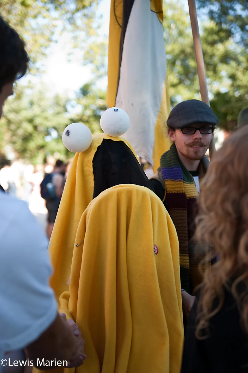 A Knox College student dressed as a Yip Yip from Sesame Street waits to greet passing students during Pumphandle at Old Main on the campus of Knox College on Sept. 9. Pumphandle is an annual event on the campus, where faculty and students greet each other the day before the fall term begins.