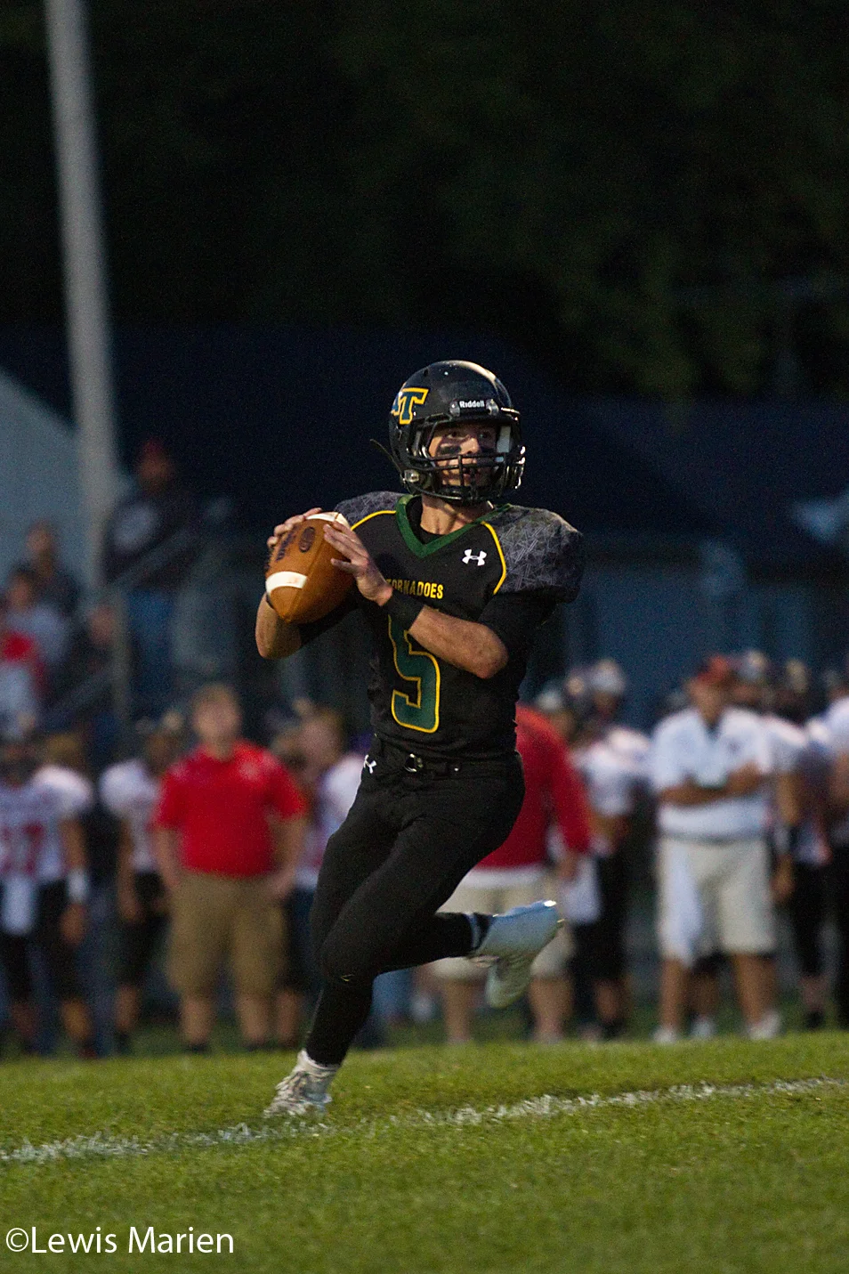 Abingdon-Avon quarterback Bo Glaser looks for an open teammate during the Tornadoes' game against North Fulton on Sept. 11 in Abingdon, Ill. The Tornadoes won 38-20.