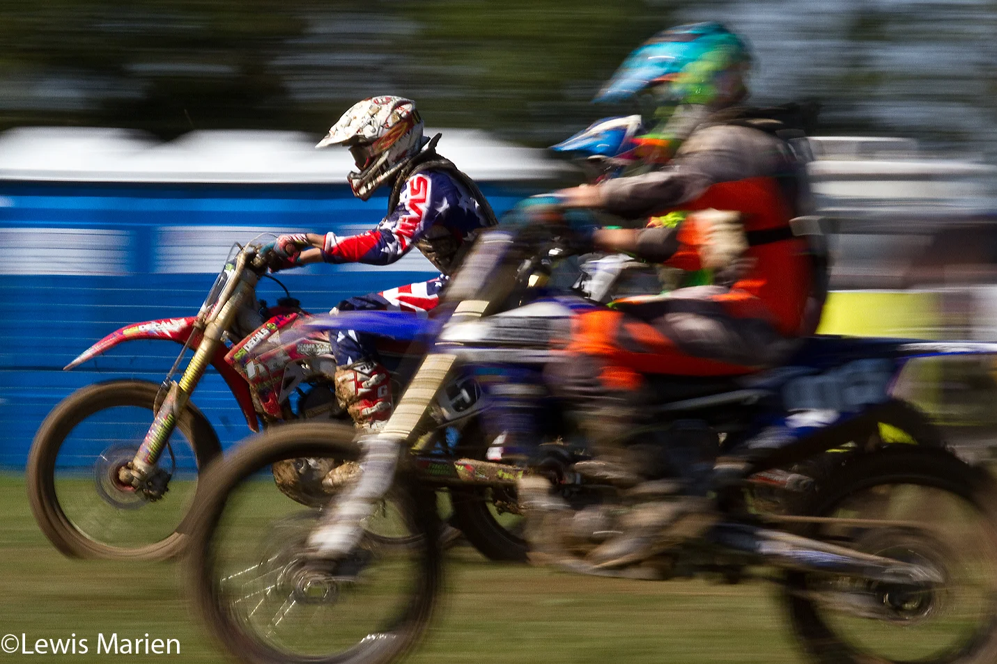 Lukas Villarreal, left, of Henderson, Ill., overtakes two other racers during the AMA District 17 Illinois State Motocross Championship on Sept. 20 at the Galesburg Motorcycle Club near Rio, Ill.