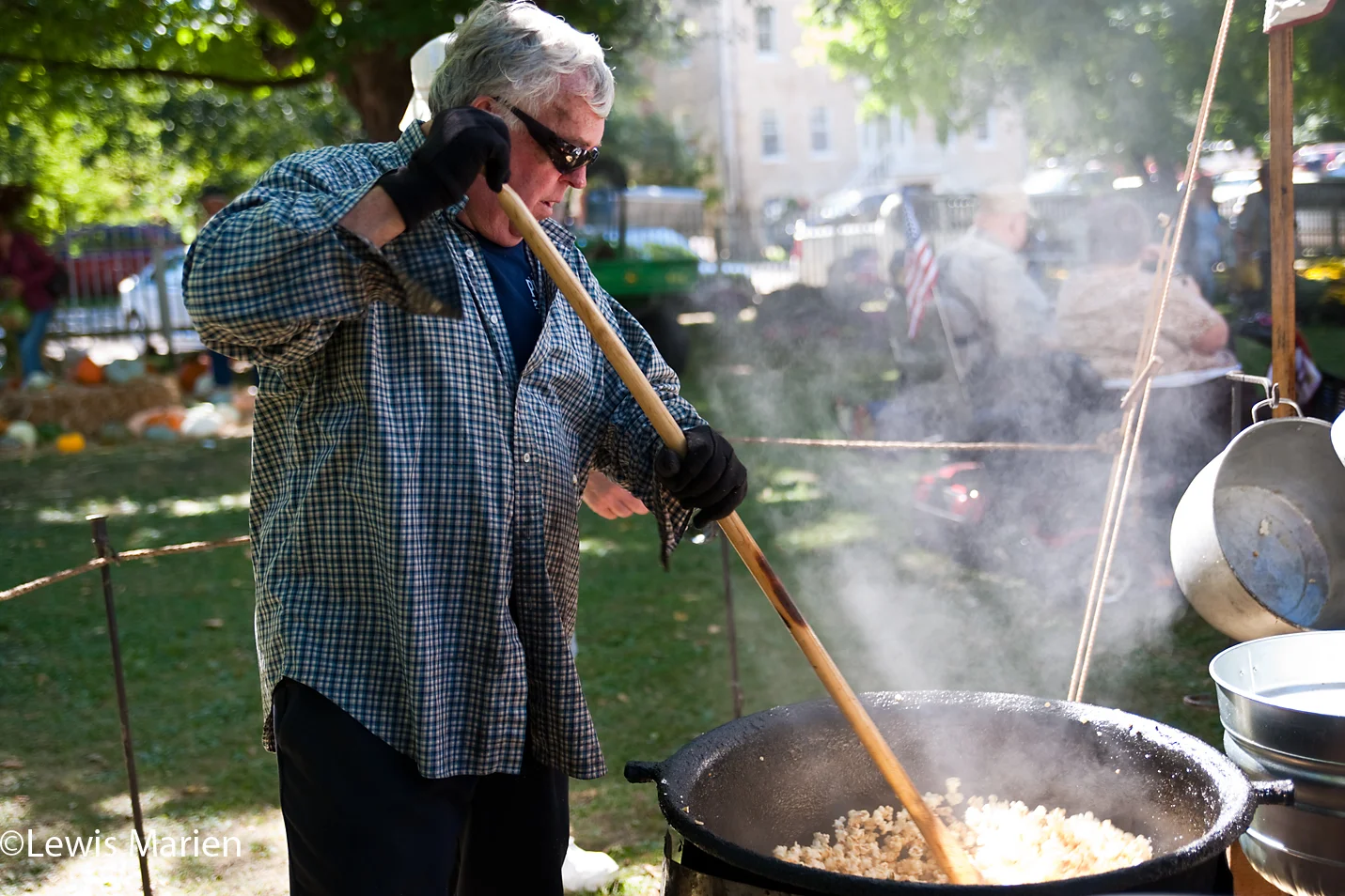 Dave Snyders, of Alton, Ill., makes popcorn on Sept. 26 during the 44th annual "Jordbruksdagarna" (Swedish for "earth work days") in Bishop Hill, Ill. Snyders runs Pioneer Karmel Korn, in an attempt to recreate how early pioneers made popcorn, by mixing oil and sugar in an iron kettle.