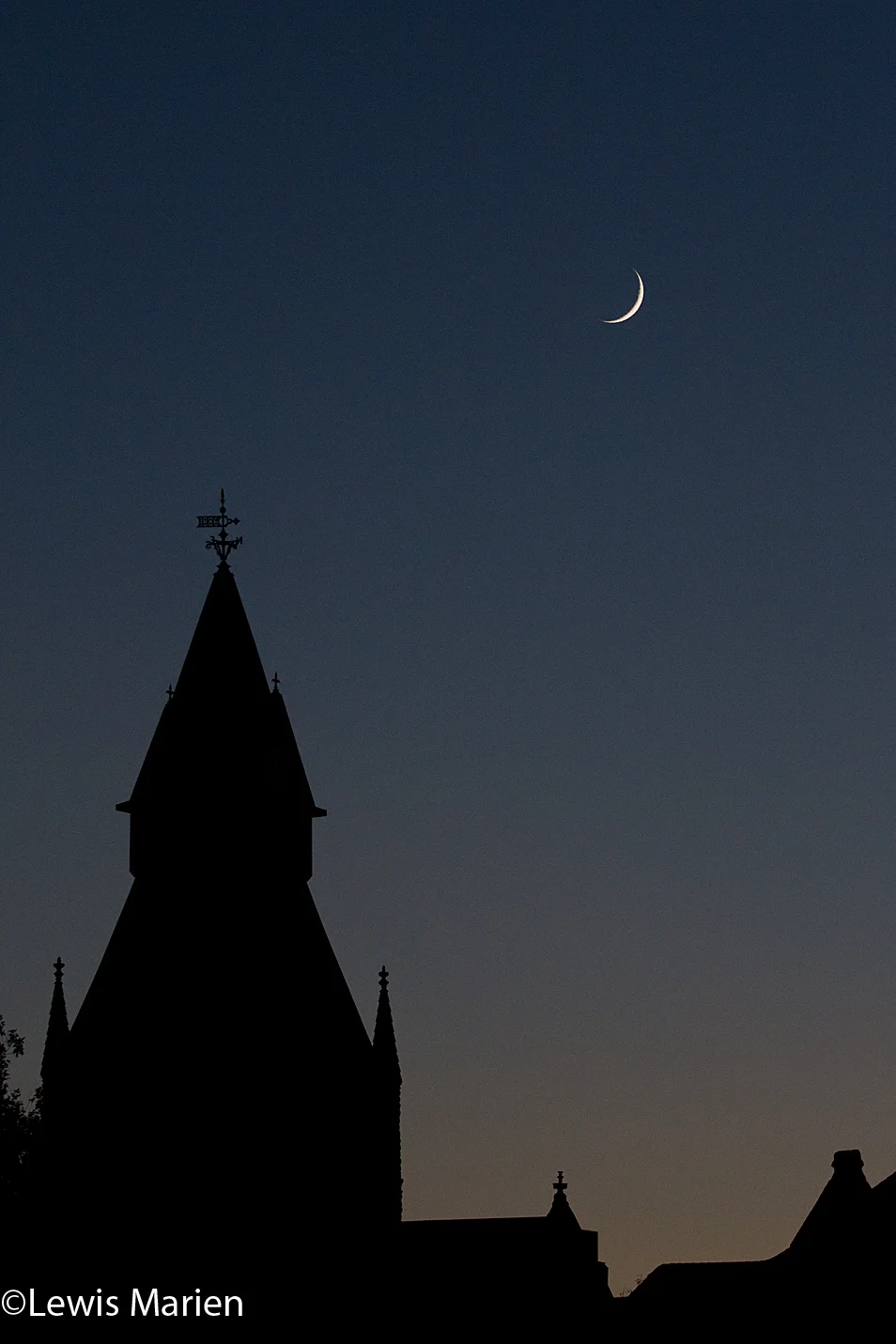 A crescent moon is seen over the Knox County Courthouse's clocktower in Galesburg, Ill., on Oct. 15.
