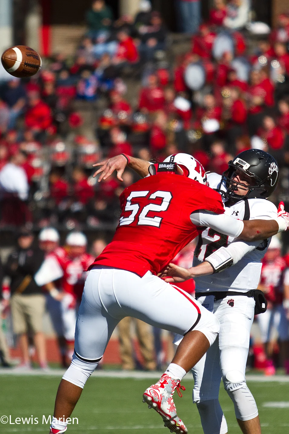 Lake Forest College quarterback Sean Dickson just gets off a pass as Monmouth College linebacker Michael Smith goes for a tackle on Oct. 17 at April Zorn Stadium in Monmouth, Ill. The Fighting Scots beat the Foresters 38-7.