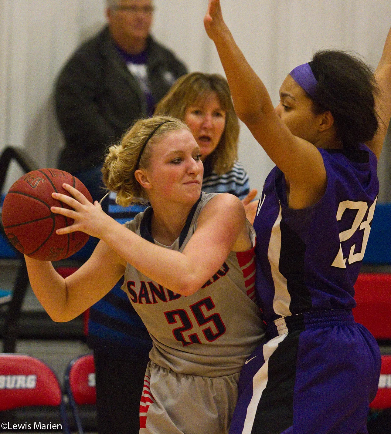 Carl Sandburg College's Kassi Henrekin tries to elude Lincoln College's Ashanti Barnett on Nov. 20 during the Chargers' game with the Lynx at Carl Sandburg College's John M. Lewis Gymnasium. The Chargers won 81-55.