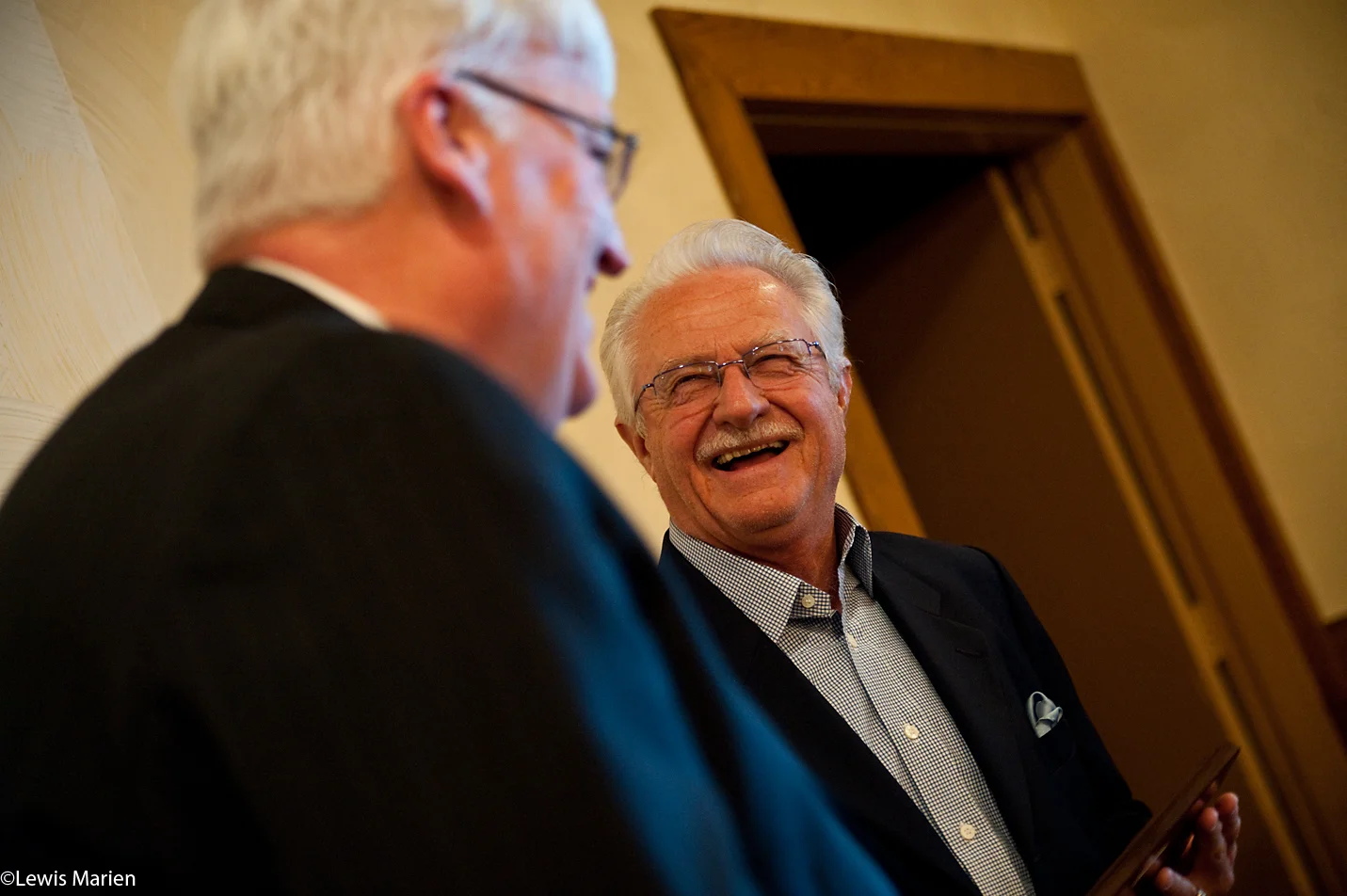 Dick Kowalski, of Galesburg, Ill., shares a laugh with mayor John Pritchard on Nov. 23 at the conclusion of the 37th annual Community Thanksgiving Luncheon at Best Western Plus Prairie Inn in Galesburg, Ill. Kowalski was named this year's recipient of the Thomas B. Herring Community Service Award, an award that recognizes a person who exemplifies true service to others without recognition or publicity.