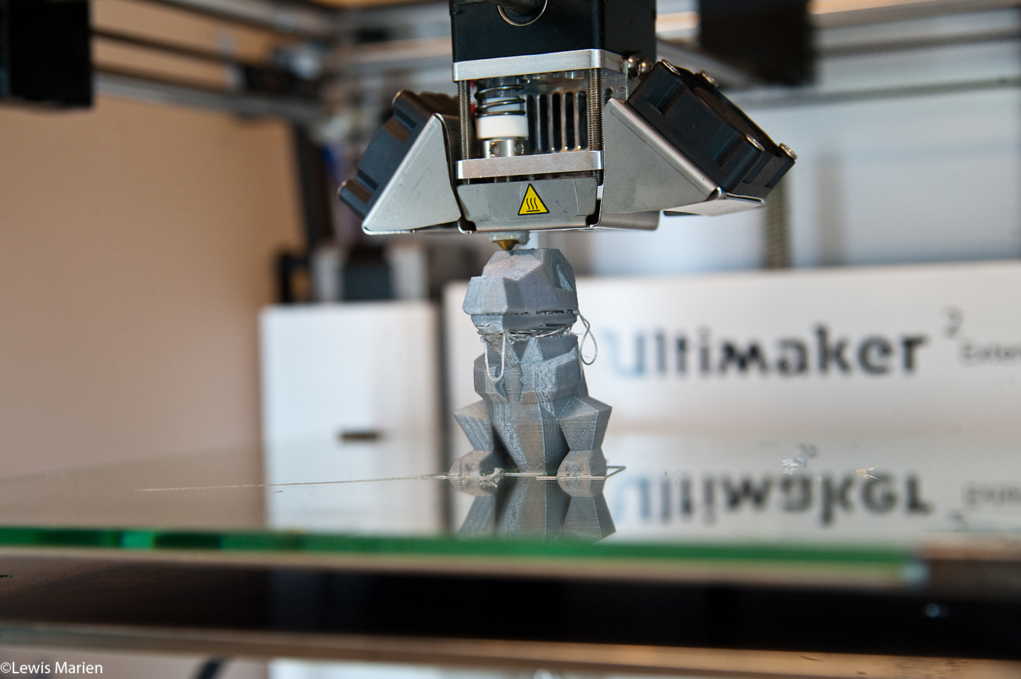 A 3-D printer puts the finishing touches on Totodile from the Pokémon series at Knoxville High School.