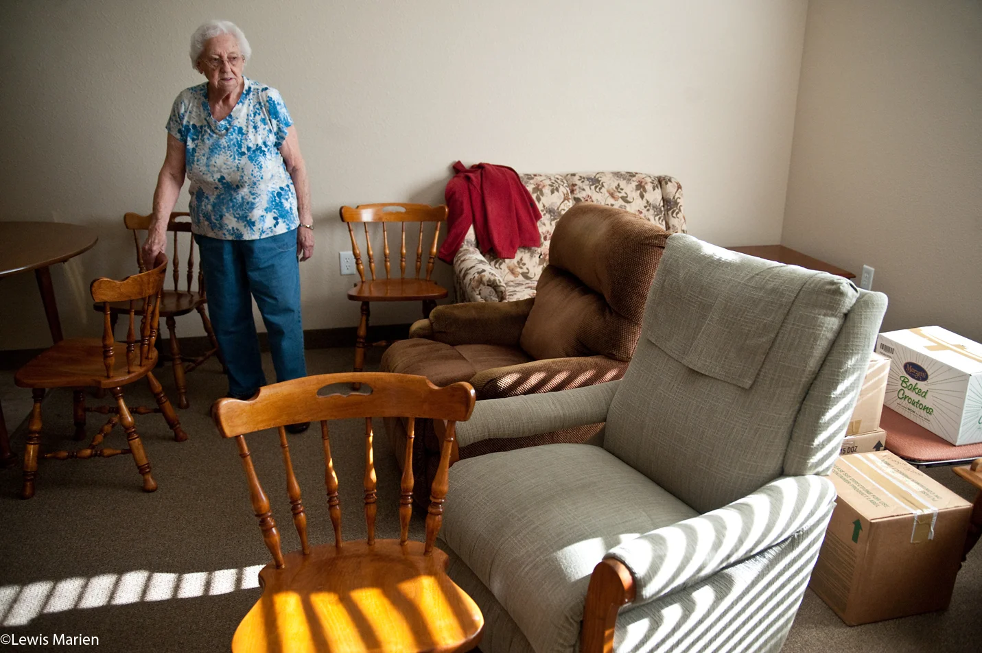 Shirley Warren, 91, of Canton, Ill., takes a look around her new living room at Courtyard Estates of Knoxville. Warren was one of the first residents to move into the new assisted living center Dec. 4, located on 415 E. Main St. in Knoxville, Ill.