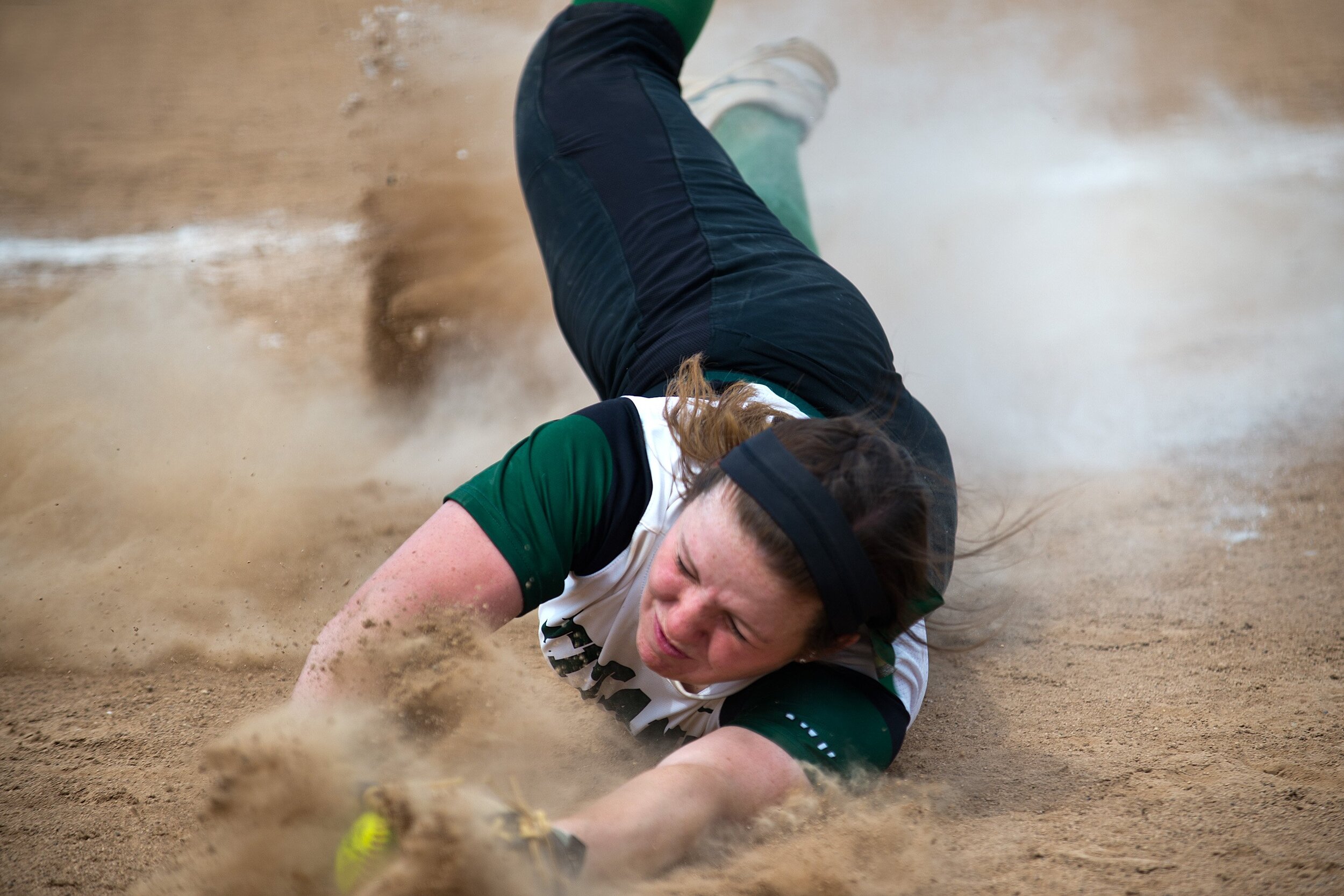  Illinois Wesleyan first baseman Kara Bischoff crashes into the dirt after catching a popup during the Titans’ 1-0 loss to Carthage in the College Conference of Illinois and Wisconsin softball tournament on Friday, May 4, 2018, in Bloomington, Illino