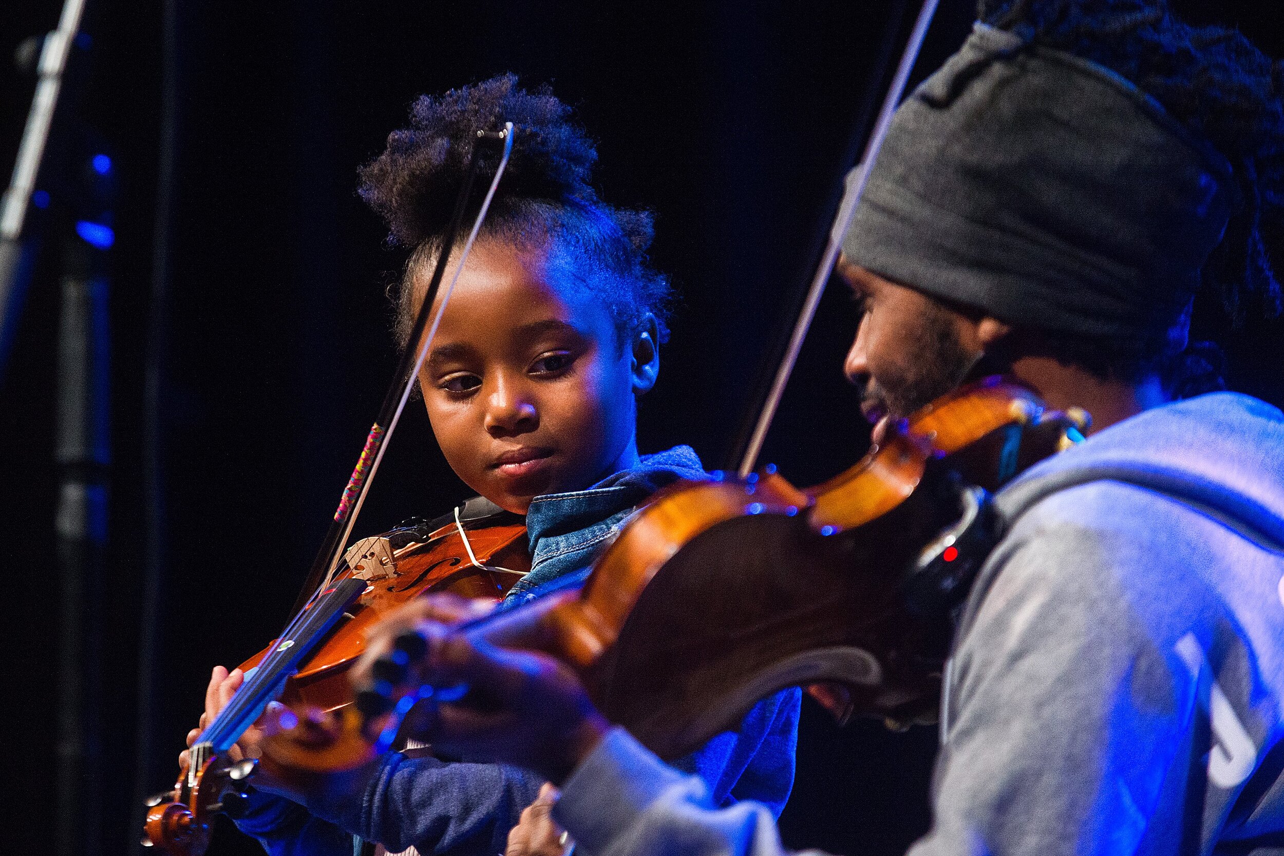  Genesis Rials, 6, participates in a play-along with Lee England Jr. during his soundcheck Saturday, April 13, 2019, at the Castle Theatre in Bloomington, Illinois. Area families were invited to the soundcheck by the Jule Foundation, a nonprofit orga
