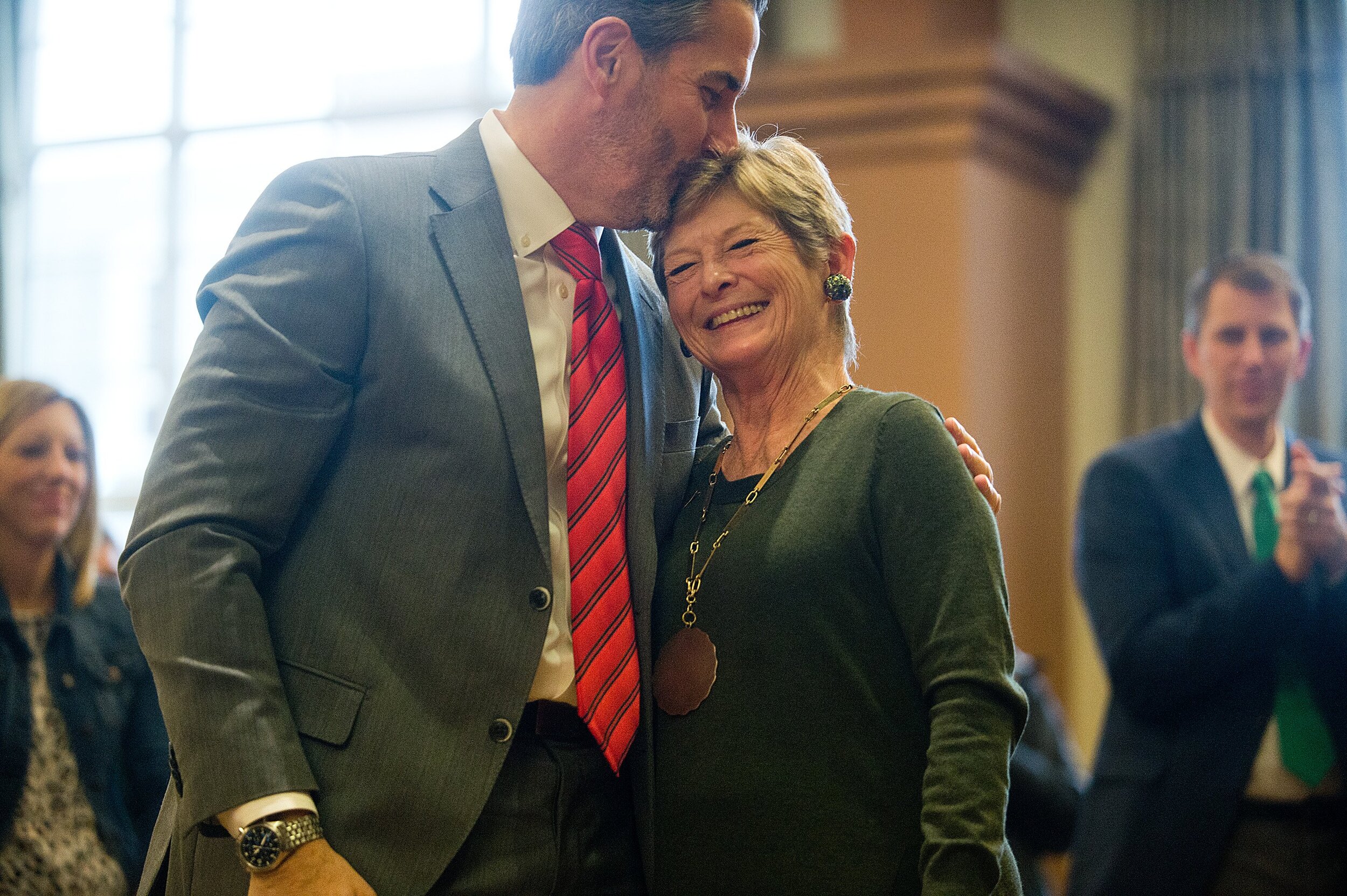  Newly-named Illinois Wesleyan University President Georgia Nugent receives a kiss from her husband, Tom Scherer, on Thursday, Nov. 14, 2019, in Bloomington, Illinois. Nugent is the first female president in the college’s history, and its 20th overal