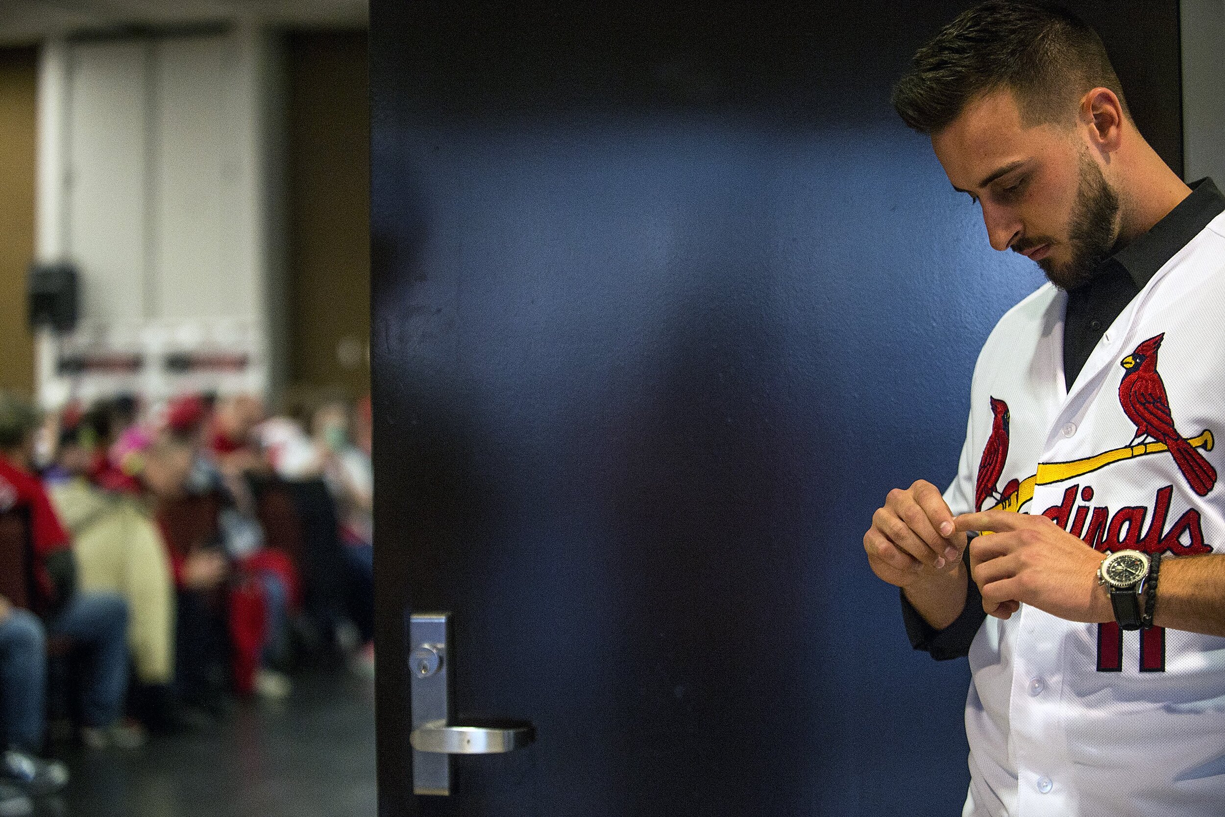  St. Louis Cardinals’ Paul DeJong waits for his announced entrance to enter a room full of fans during the Cardinal Caravan stop Saturday, Jan. 13, 2018, at Parke Regency Hotel and Conference Center in Bloomington, Illinois. DeJong is a former Illino