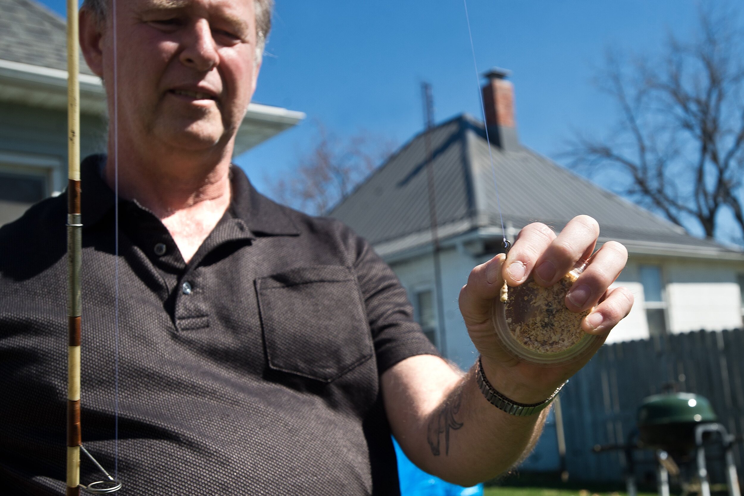  Dennis Fett places bait on one of his fishing rod hooks on Tuesday, April 9, 2019. Since undergoing deep brain stimulation surgery to control his Parkinson's disease symptoms, Fett has been able to fish again, returning to one of his favorite hobbie