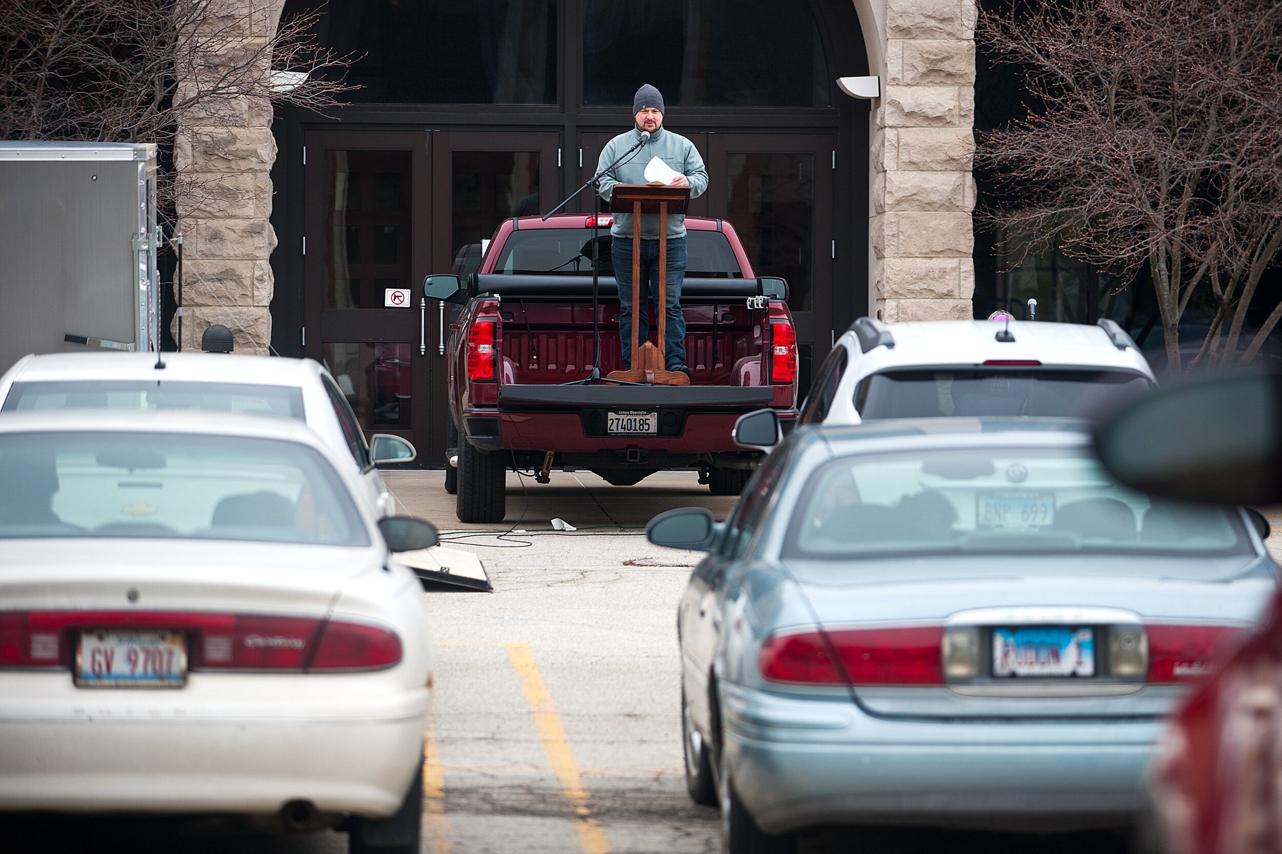  The Rev. Trey Haddon, senior pastor at Second Presbyterian Church, delivers his sermon on Sunday, March 22, 2020, during a drive-in worship service outside the church in Bloomington, Illinois. Due to the COVID-19 pandemic, the church is finding new 