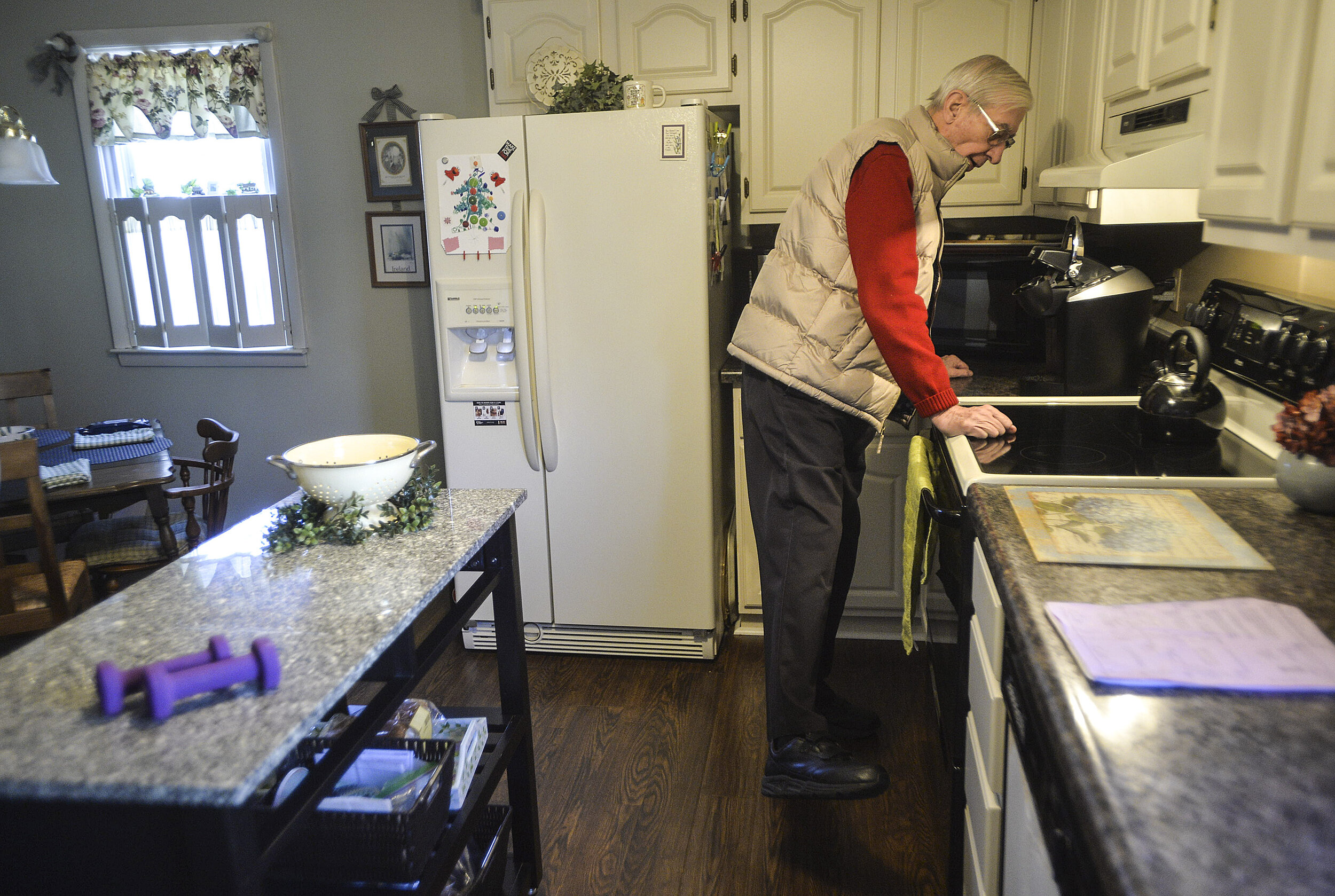  Rich Buchanan holds onto a kitchen counter to keep his balance Friday, Feb. 2, 2018, at his home in Bloomington, Illinois. Rich is exercising daily to work his body and mind, and reduce his risk of falling. 