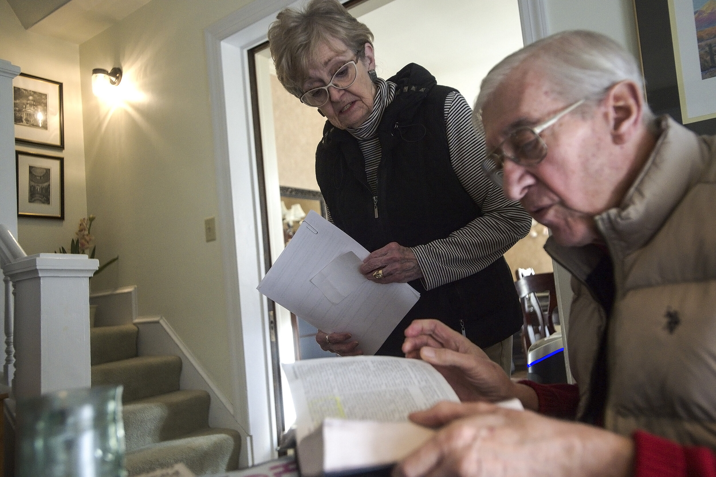  Judy Buchanan looks on as her husband, Rich, flips through a Bible on Friday, Feb. 2, 2018, at their home in Bloomington, Illinois. Rich Buchanan’s faith is helping him to live with his Alzheimer’s diagnosis. 