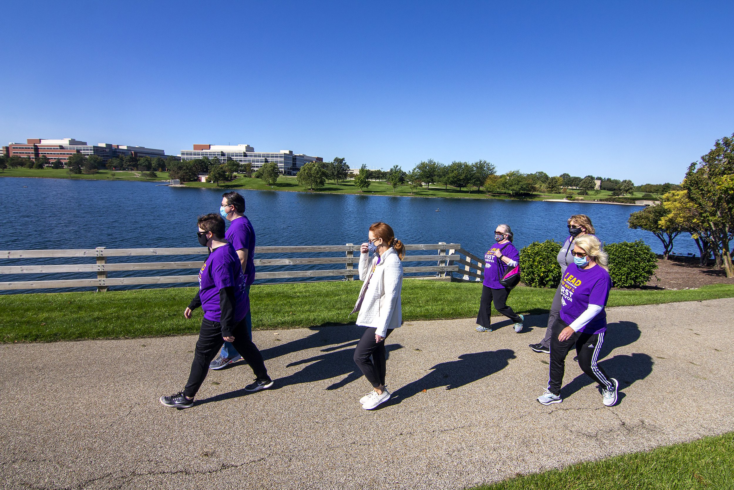  Walking with Integrity team members Katie Krueger, Josh Krueger, Cindy Giessinger, Sarah Krueger, Janie Rainey and Shannon Gerwick participate in the annual Bloomington-Normal Walk to End Alzheimer’s by walking a trail near State Farm Corporate Sout