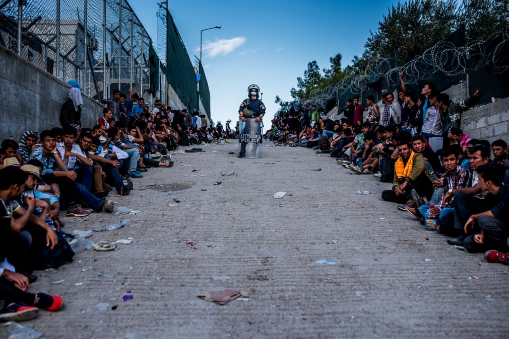 Crossing Borders, Greece, 2015 Refugees waiting in a queue for registration in the Moria camp on the island of Lesbos Photograph: István Bielik