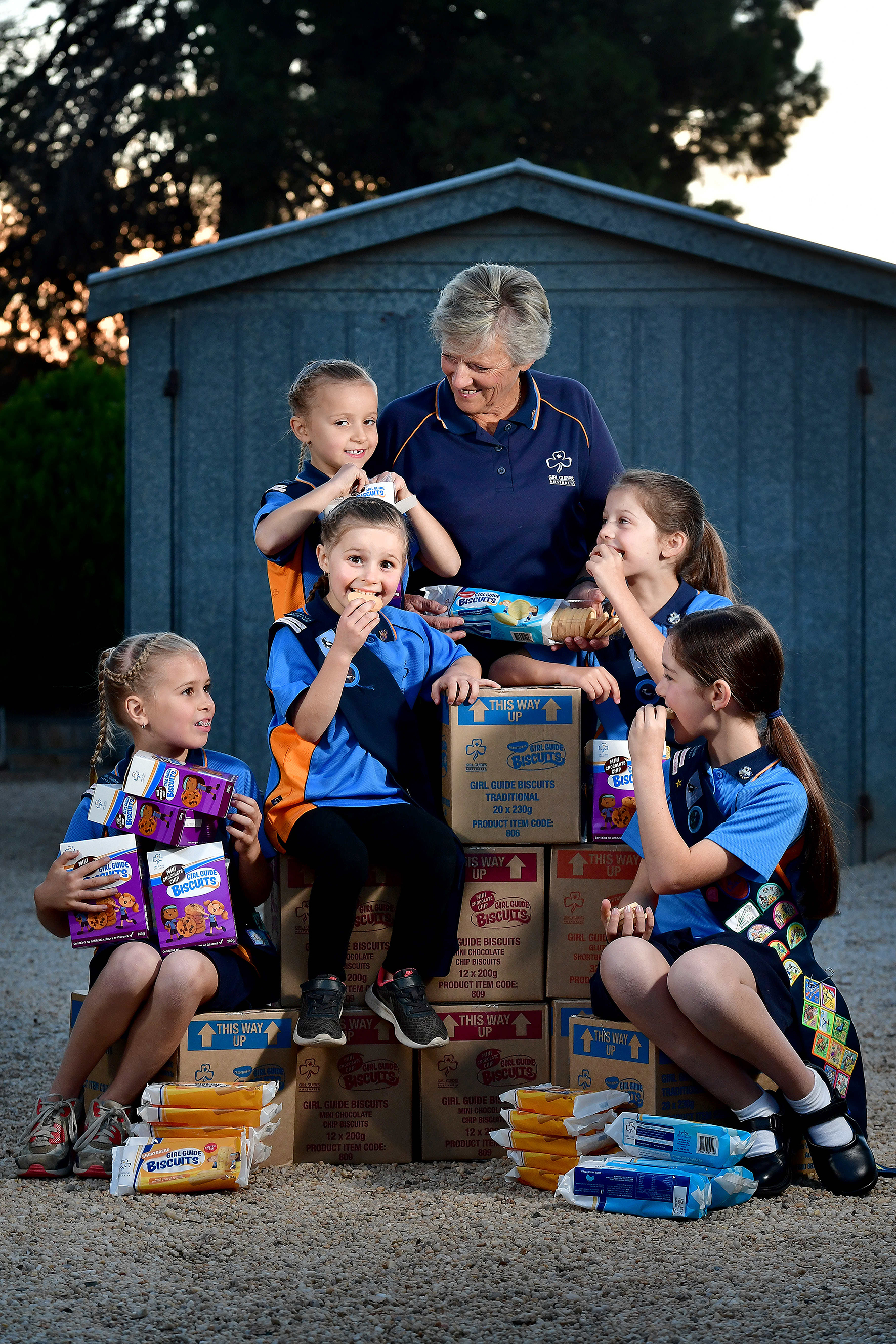  25.5.18 - Sue Cruickshank with her Girl Guide grand-daughters Mia Cruickshank (9), Ava Cruickshank (5), Zoe Cruickshank (6), Annabelle Marafioti (8) &amp; Sophie Marafioti (10), at her Gawler home. This year marks 60 years of selling Girl Guide Bisc