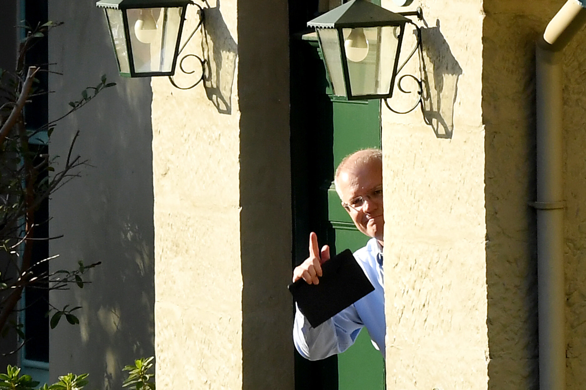  Newly re-elected Australian Prime Minister is seen looking out the door to expected media at Kirribilli House, Sydney, Sunday, 19 May, 2019. Scott Morrison lead the Coalition to an expected win in the 2019 Federal Election, becoming Australia's 30th
