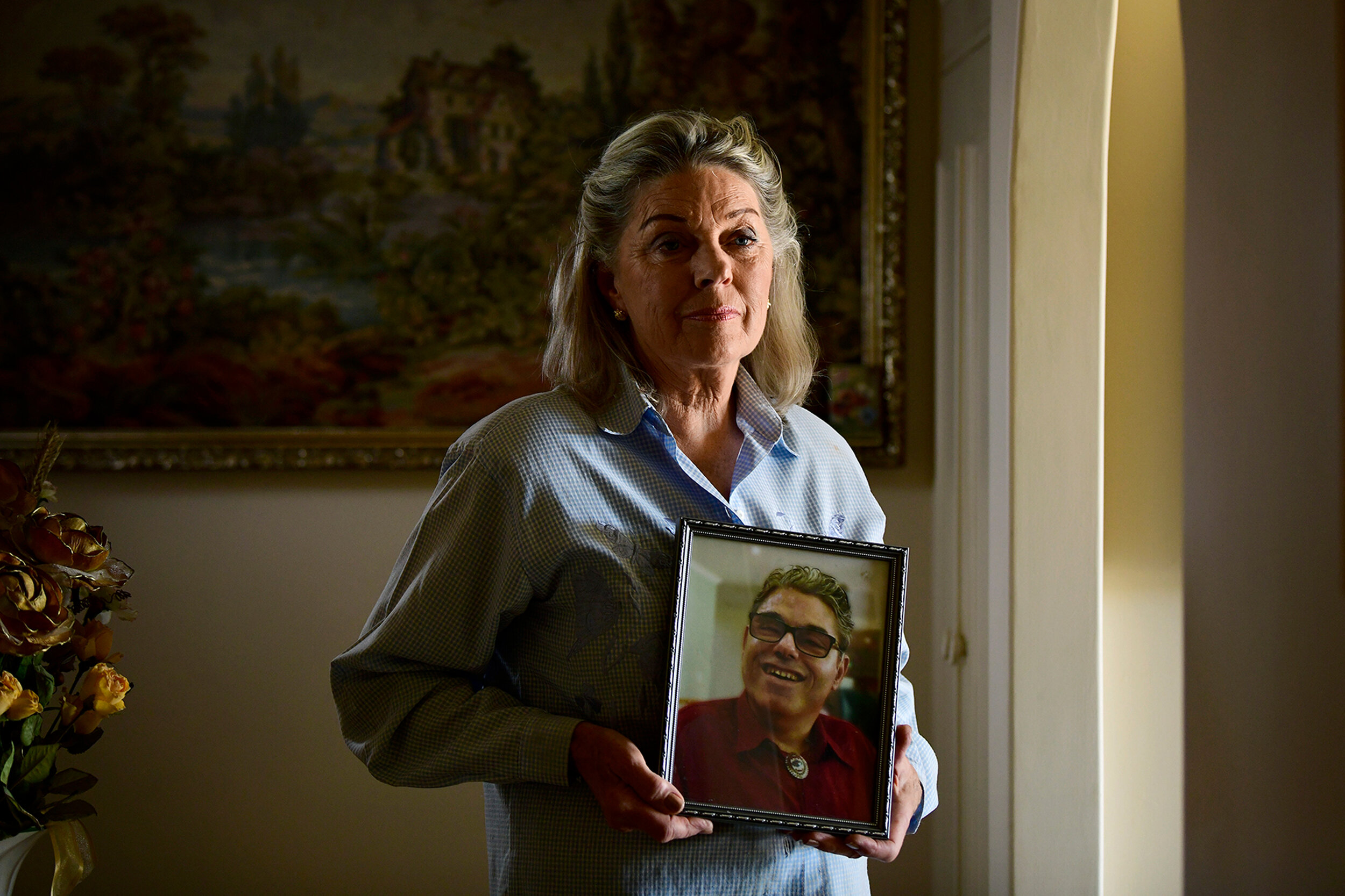  31.1.19 - Dianne Badman holds a photo of her son Jason Foster, who died in August 2017 after spending 18 months in FMC. Jason lived at the Minda Nursing Home, which had sanctions placed on it late last year, but left after suffering a fall. Pictured