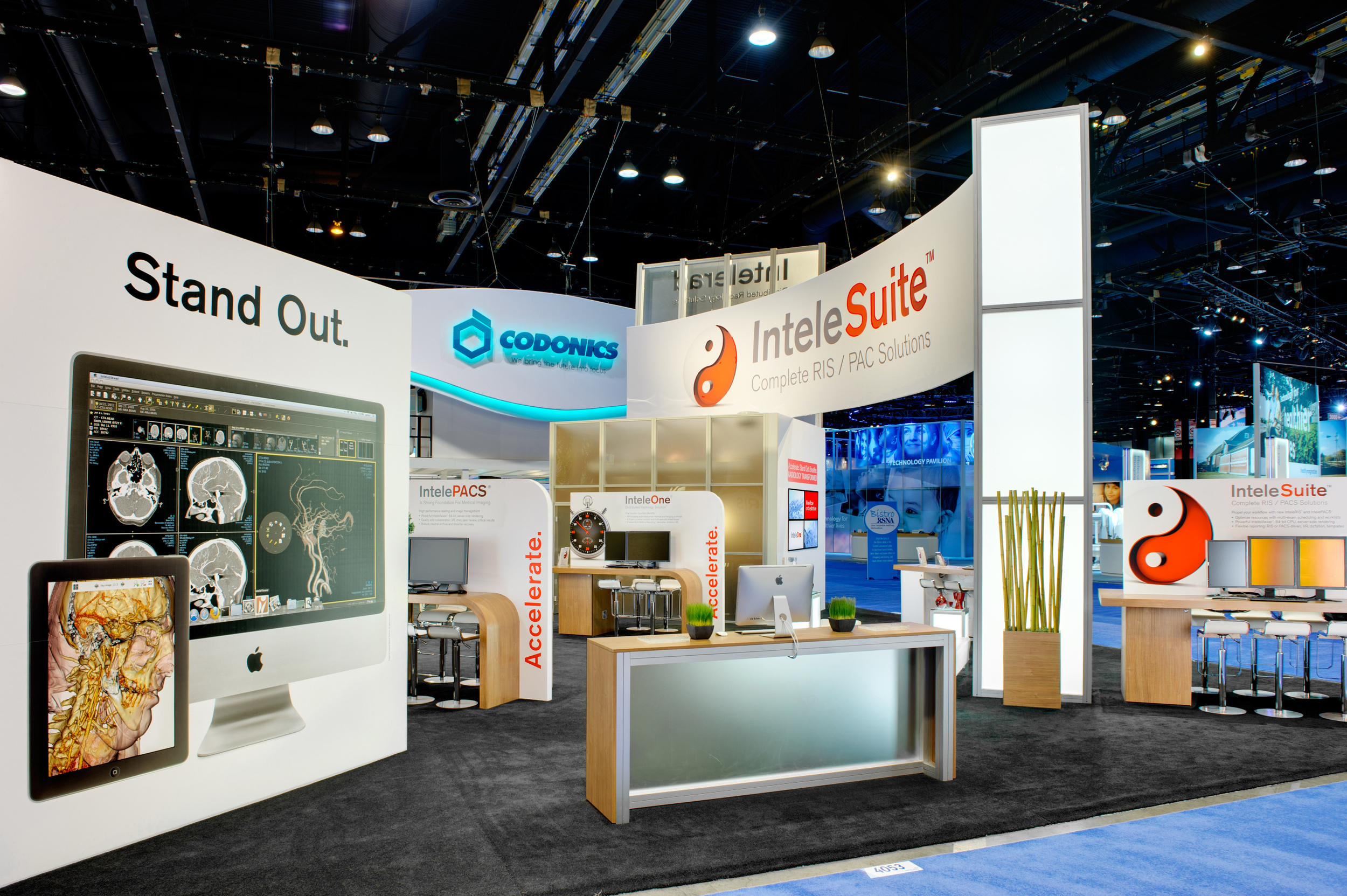 A view of Intelerad's trade show booth rental showing the large graphics and light tower