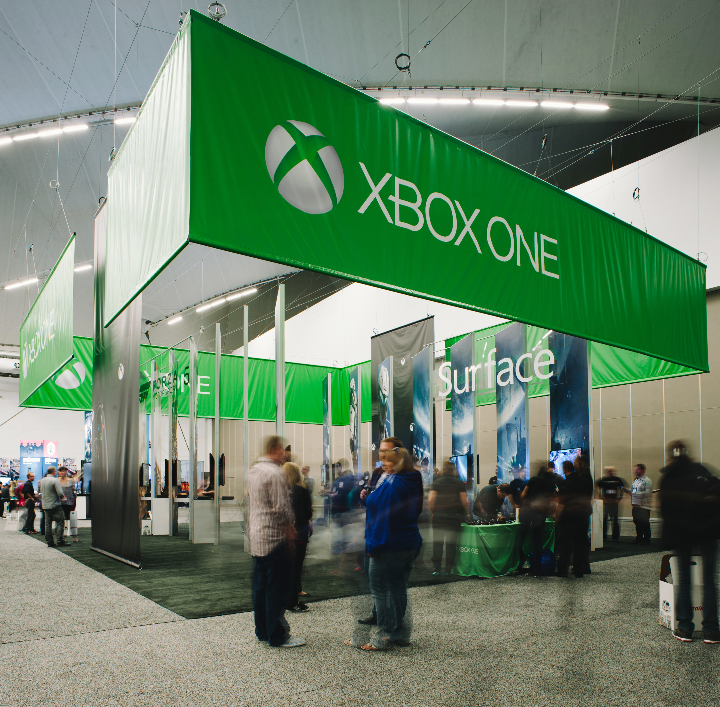 A large hanging banner, over-sized graphics, and integrated AV combined with custom pedestals for the Xbox One launch event at EB Games