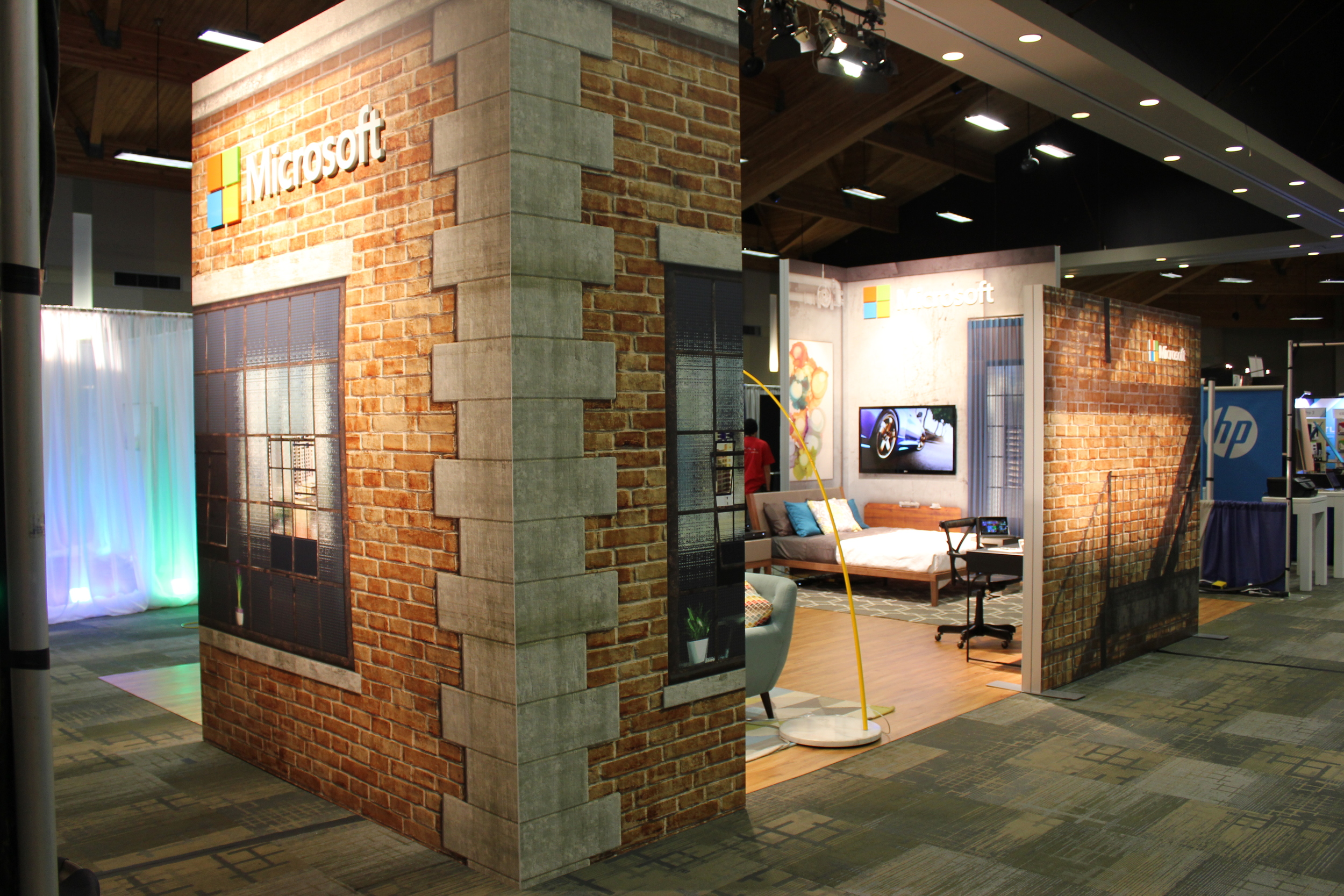 Large digitally printed graphics, wood flooring, and designer staging allows Microsoft to showcase product in an experiential way
