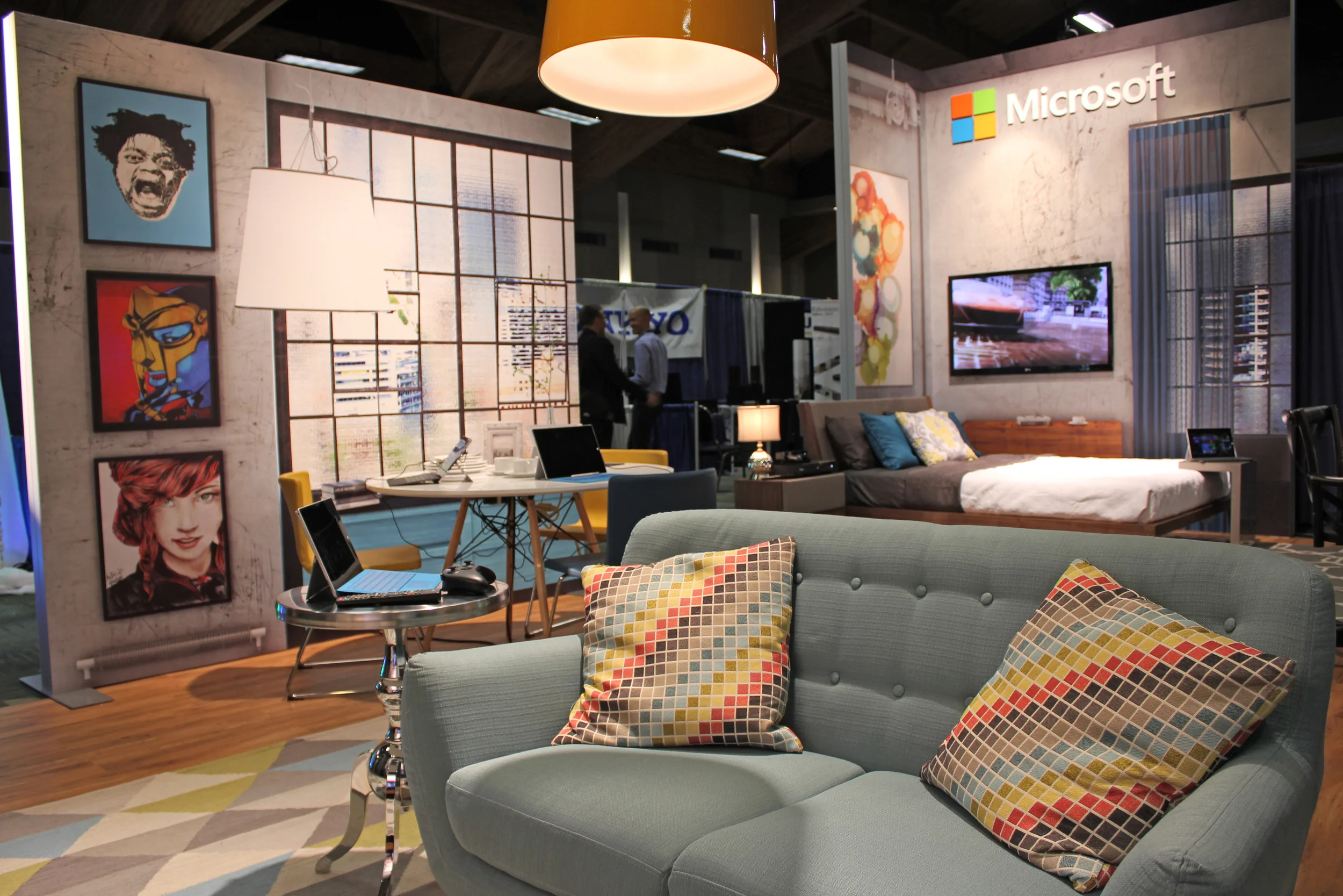 Large digitally printed graphics, wood flooring, and designer staging allows Microsoft to showcase product in an experiential way